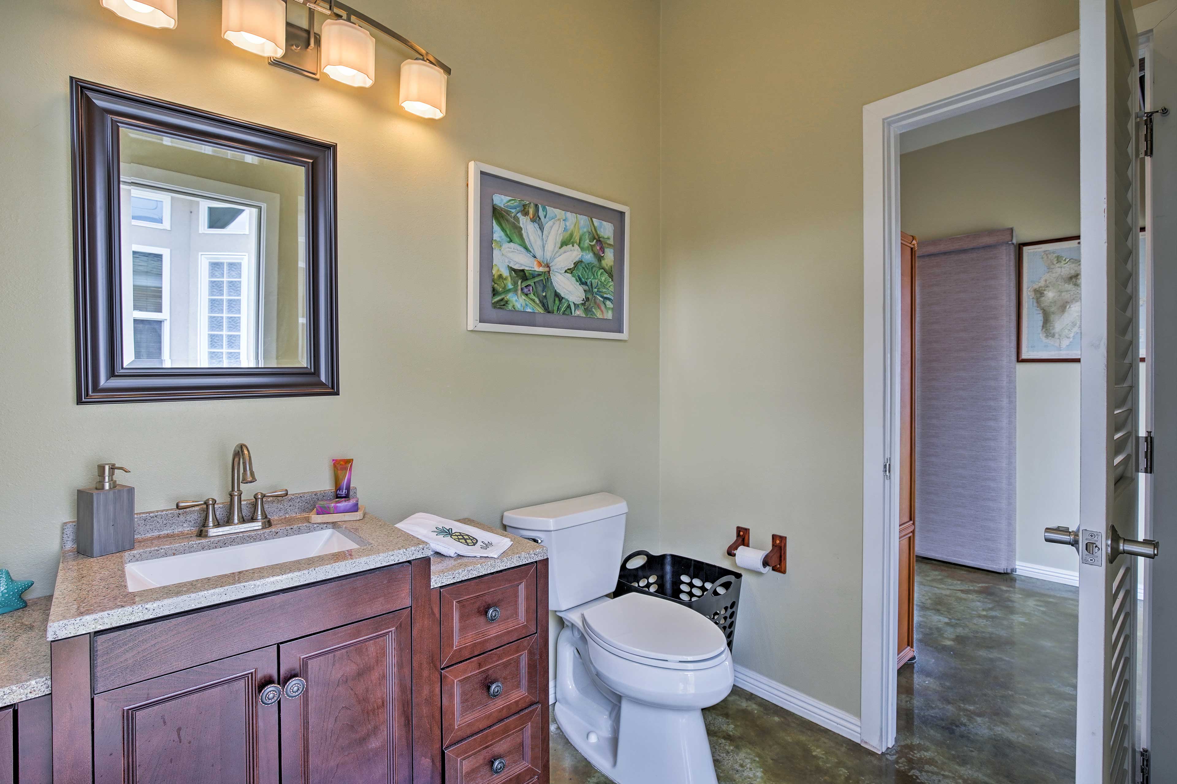 The full bathroom is furnished with modern elegance.