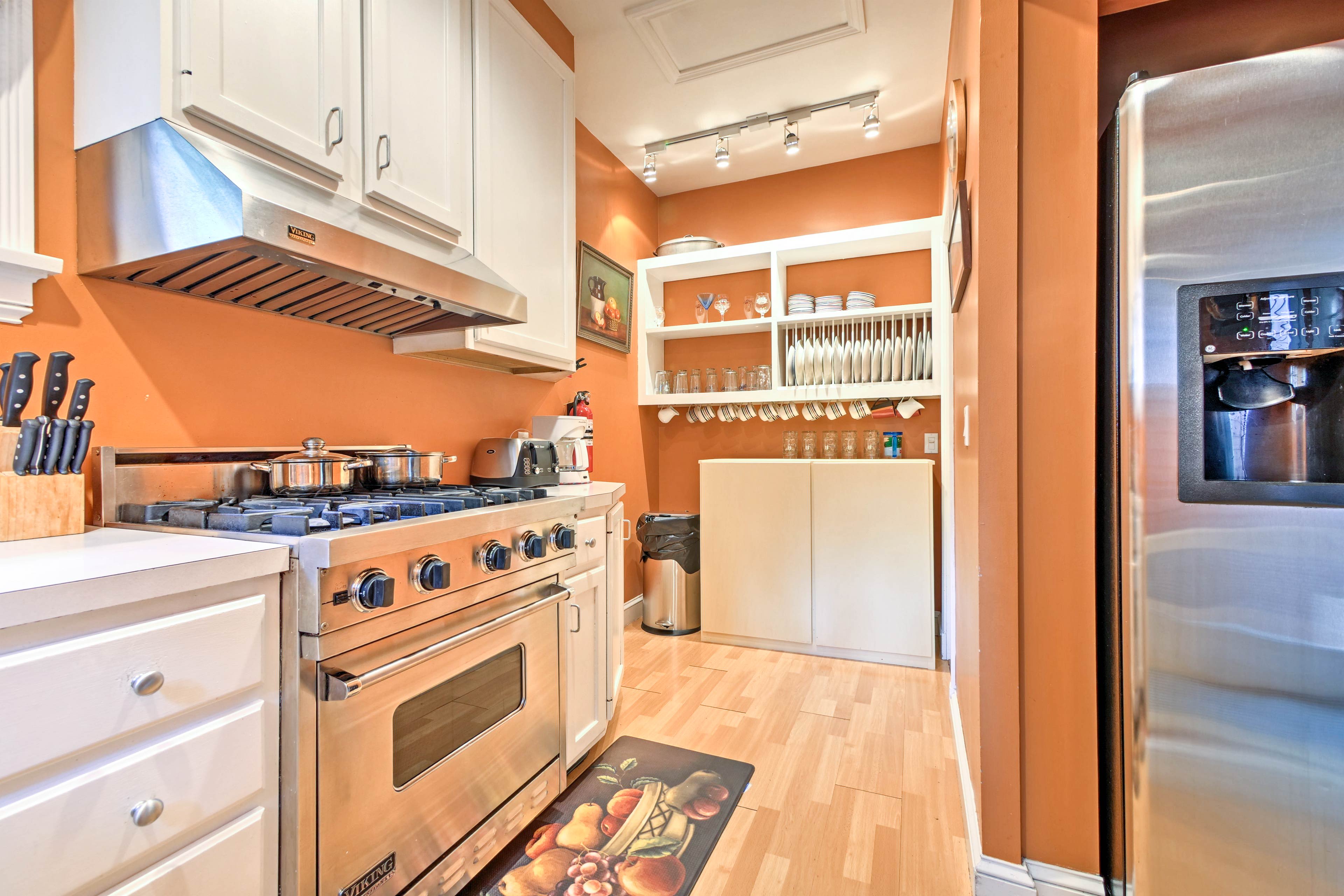 The fully equipped kitchen has been updated with stainless steel appliances.