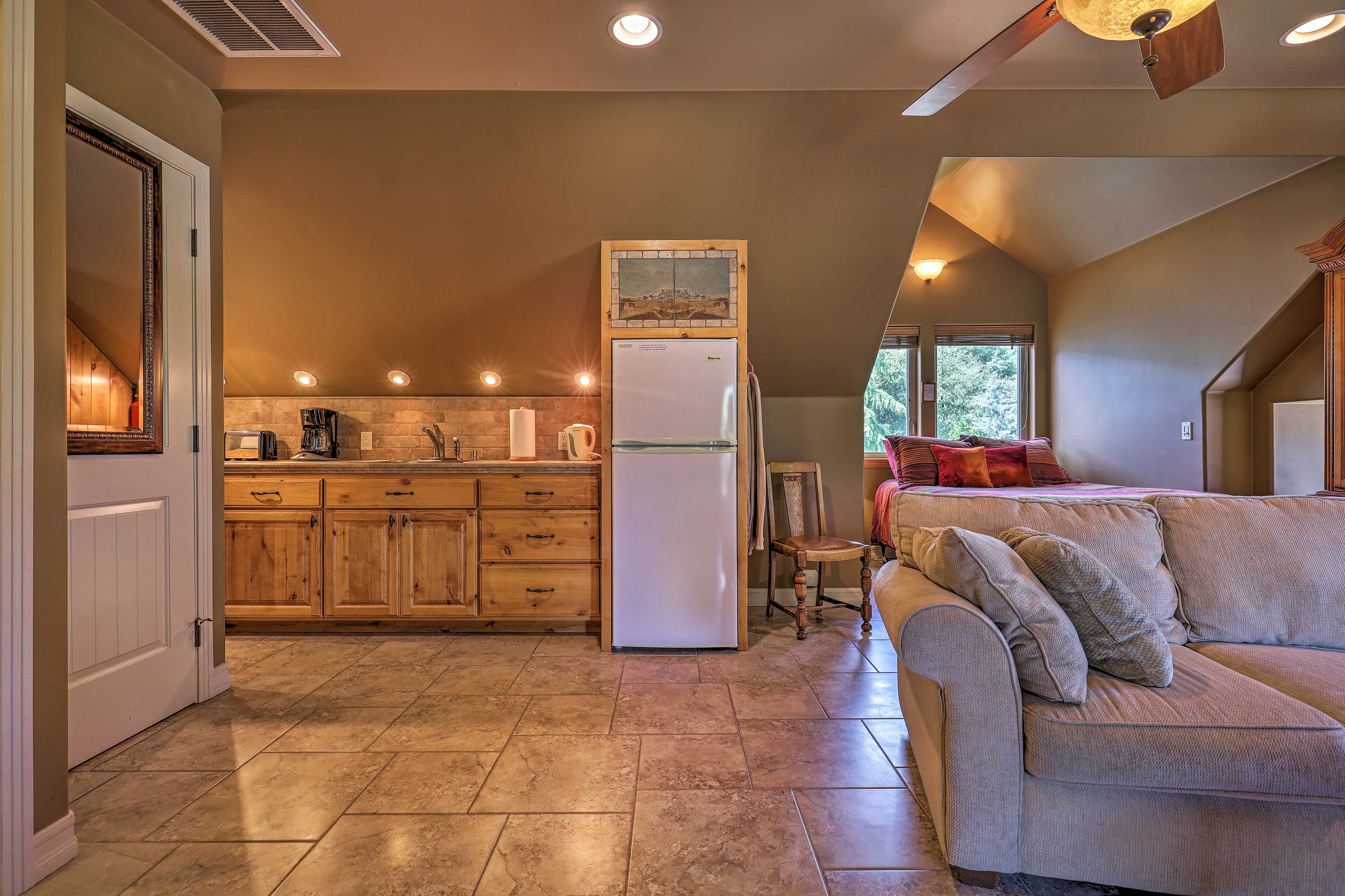 The custom tile-flooring and high ceilings provide a modern, airy feel.