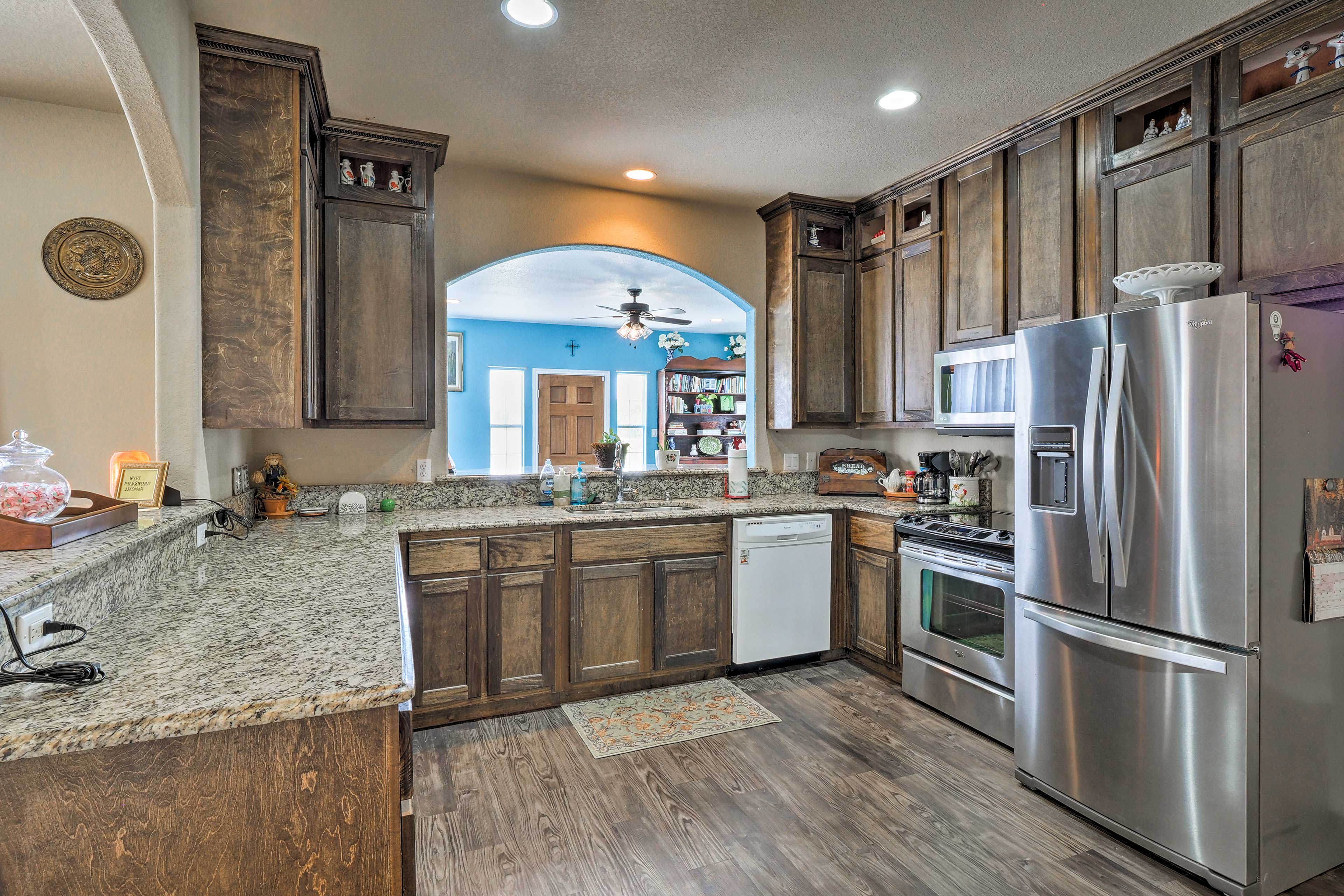 The kitchen boasts beautiful granite counters and stainless steel appliances.