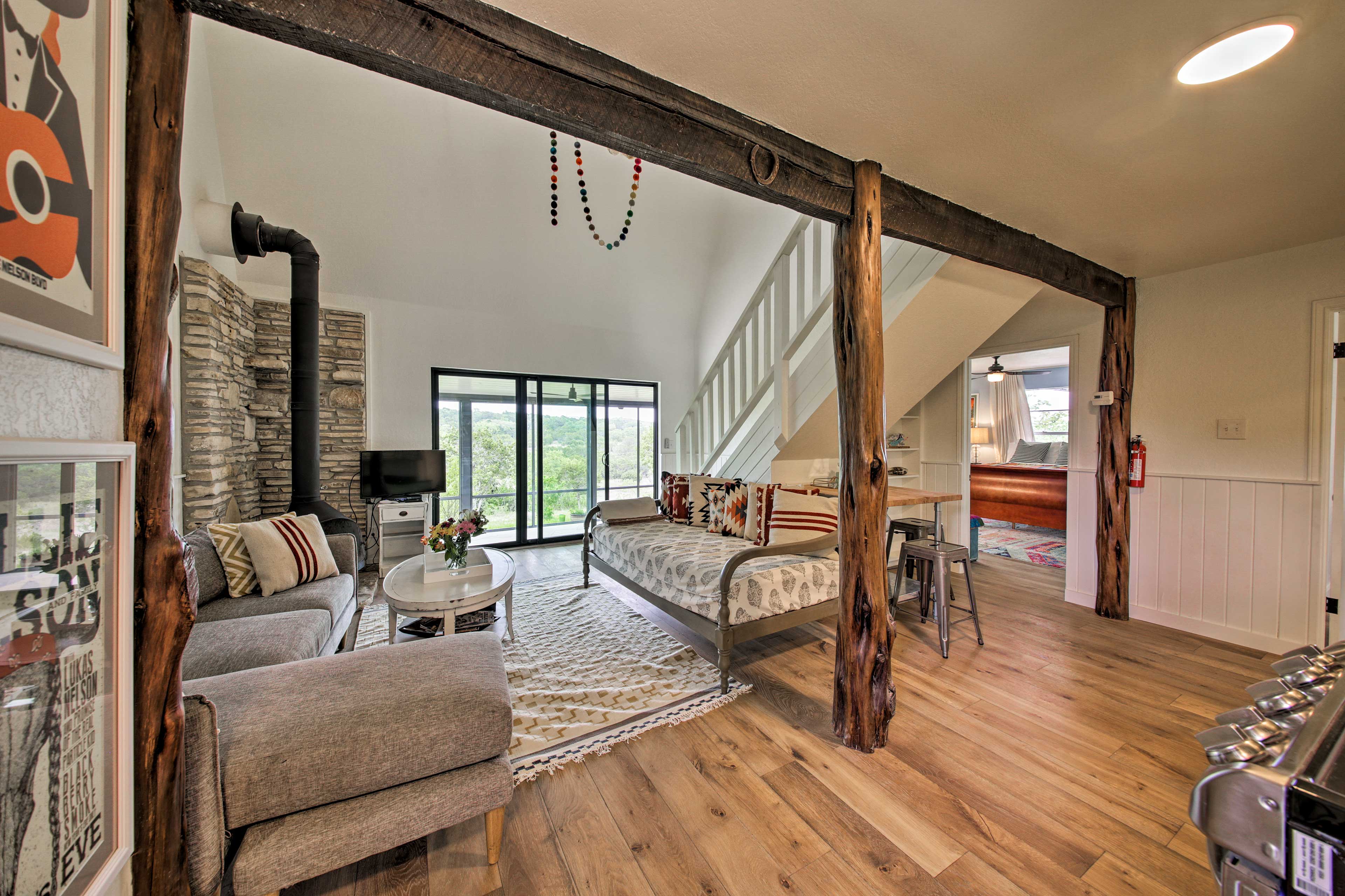 Log pillars & exposed brick beams enhance the home's rustic character.