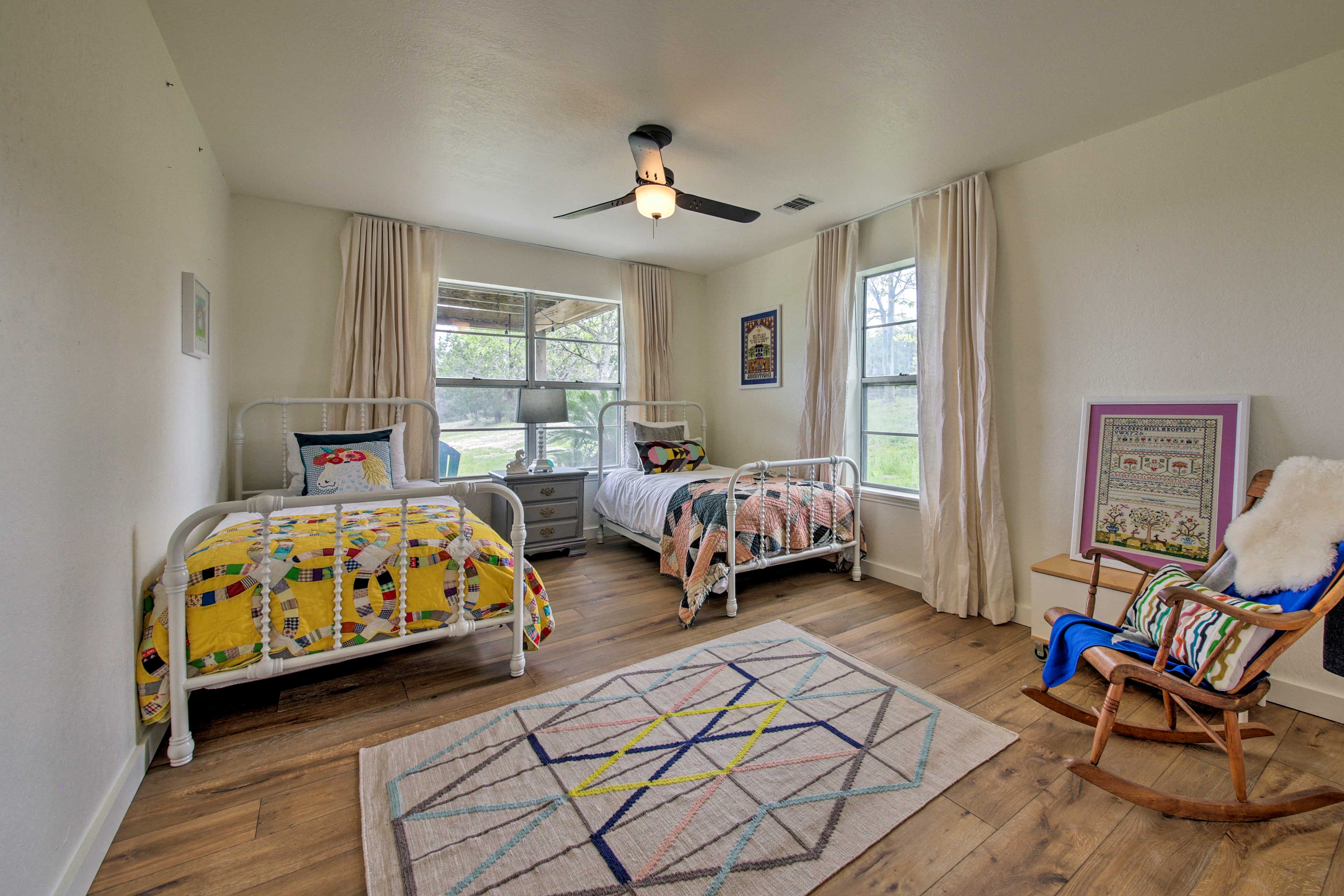 Two people can get comfy in this charming bedroom with 2 twin beds!