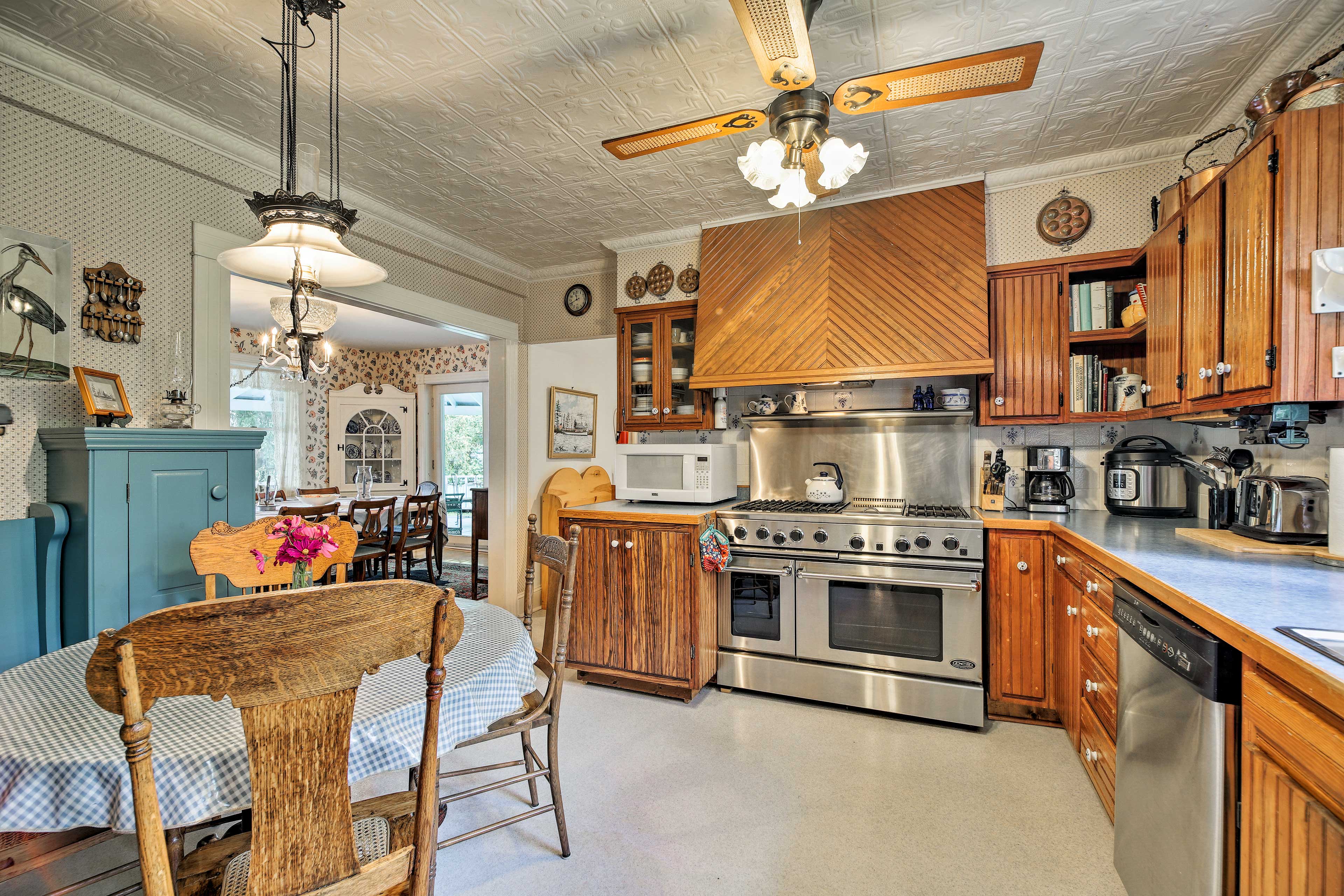 The kitchen boasts commercial-sized stainless steel appliances.