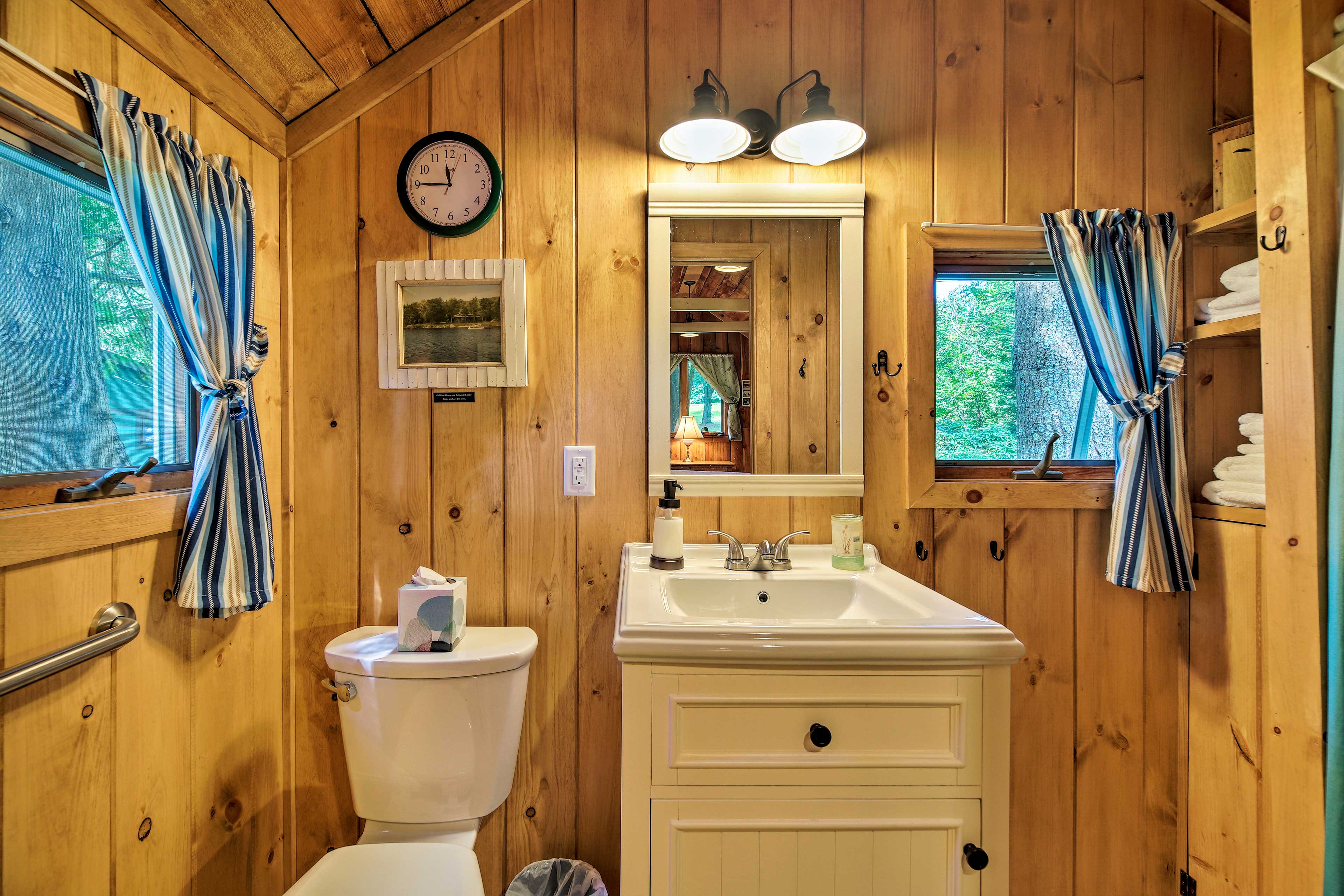 This second bathroom includes a shower/tub combo.