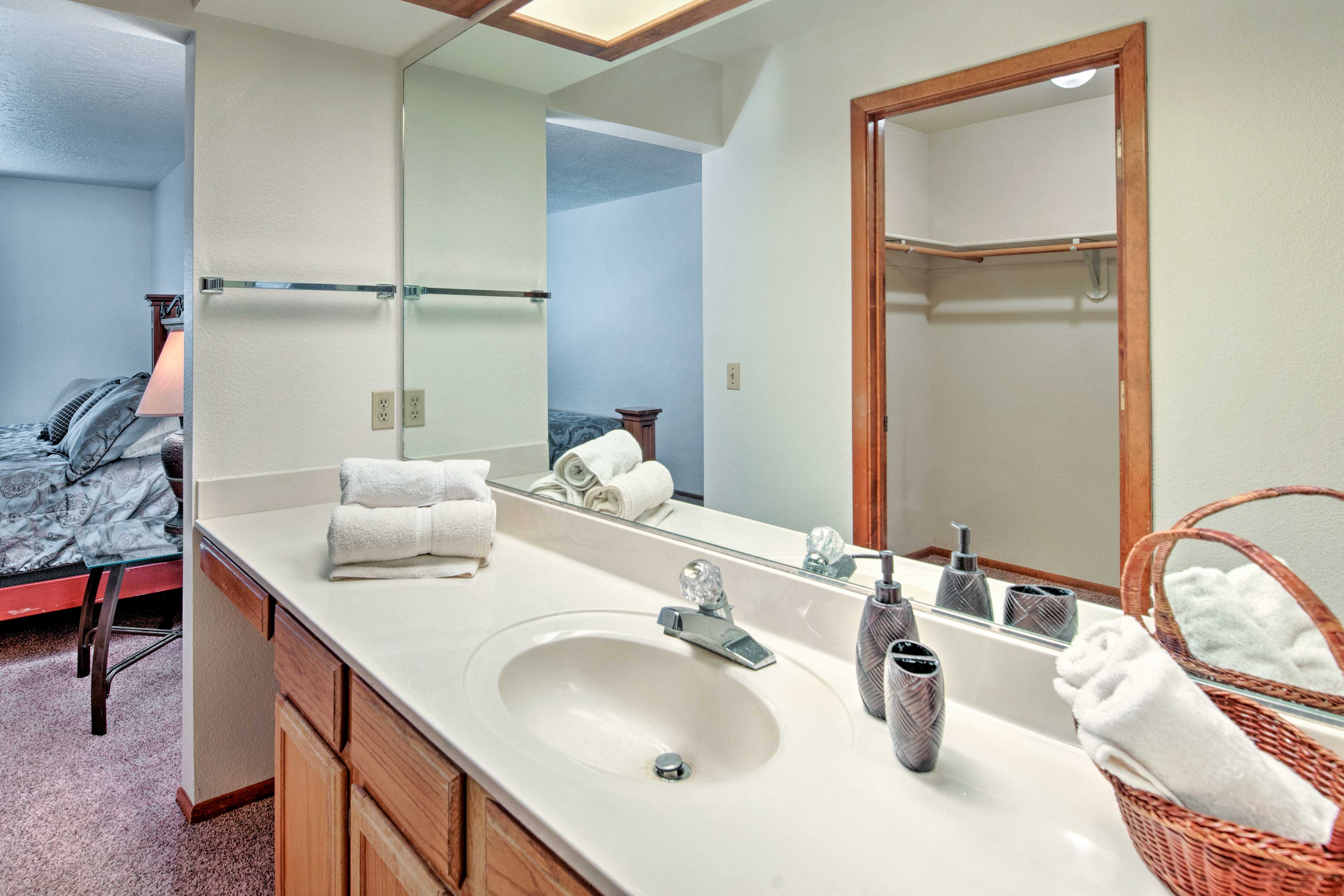 Freshen up at the mirrored vanity before your daily adventures.