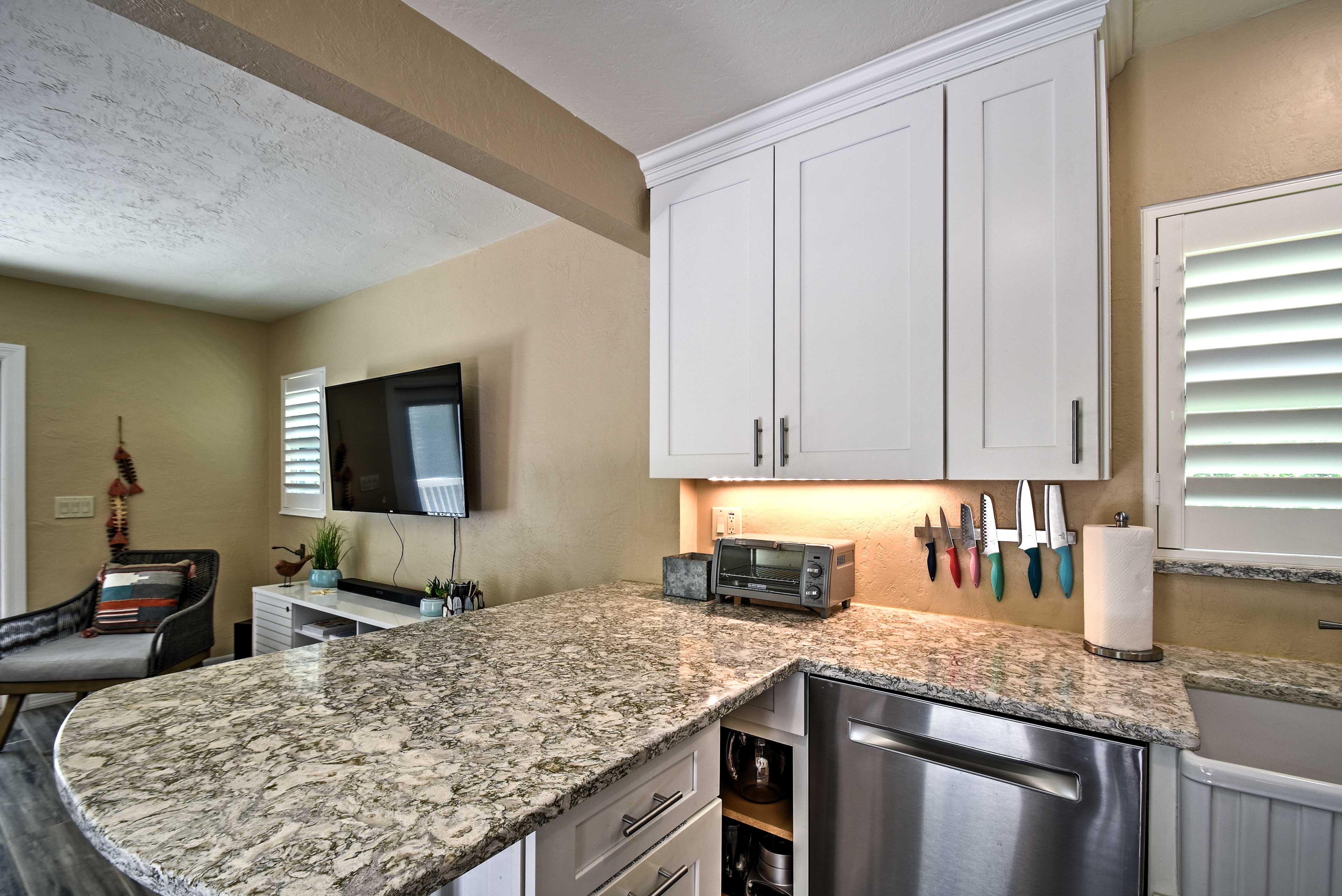 The contemporary-style kitchen boasts granite countertops.