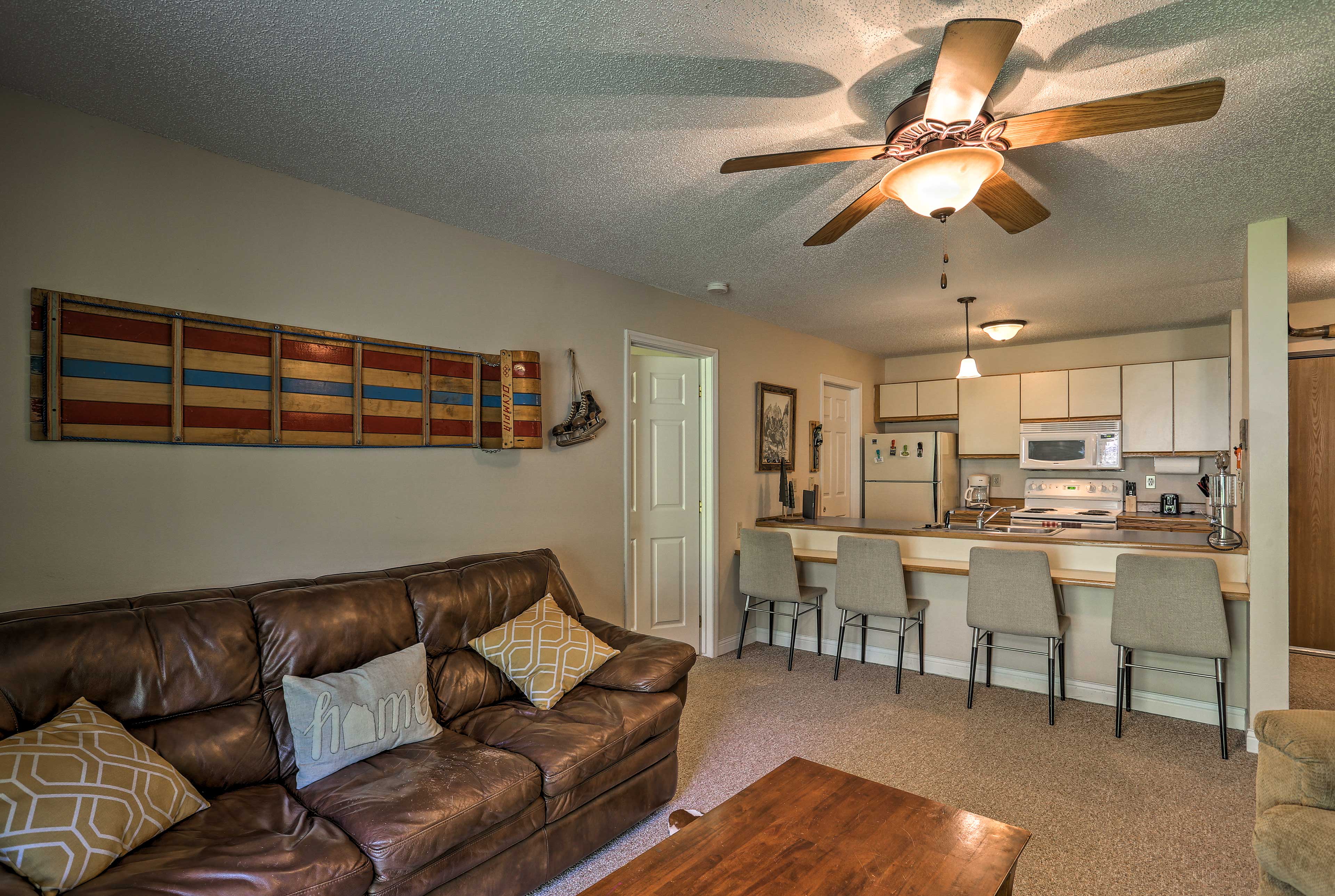 The living area is draped in winter-themed decor.