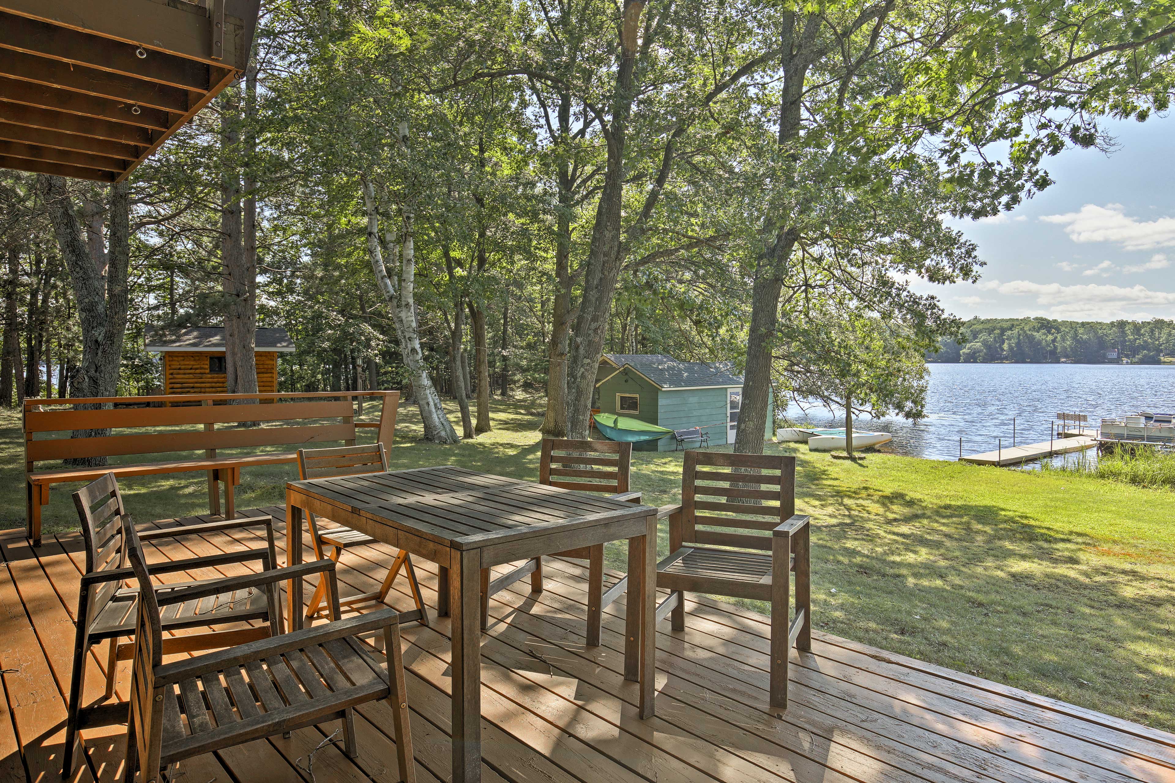 Relax on the spacious deck with stunning lakefront views!