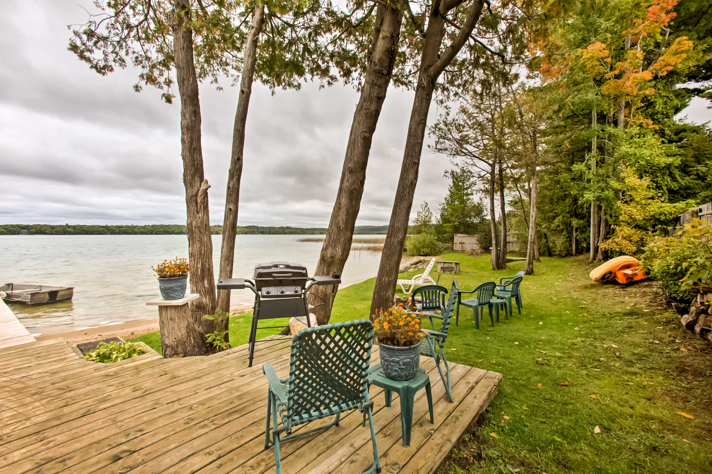 Backyard | 'Currier's Cottage' | Direct Access to Little Traverse Lake | 4 Boats