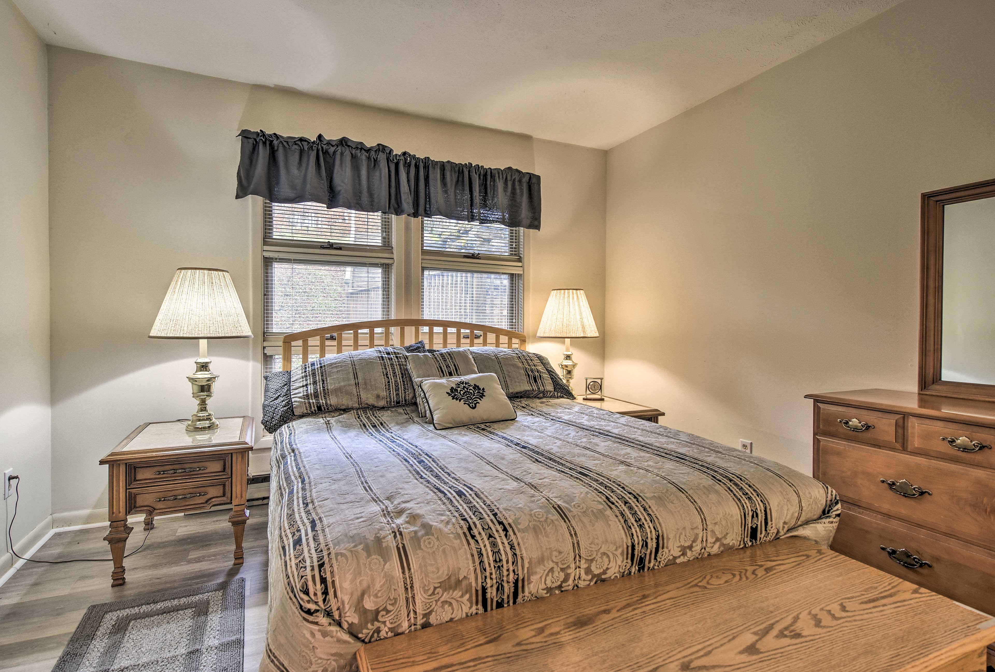 A queen bed highlights this first bedroom.