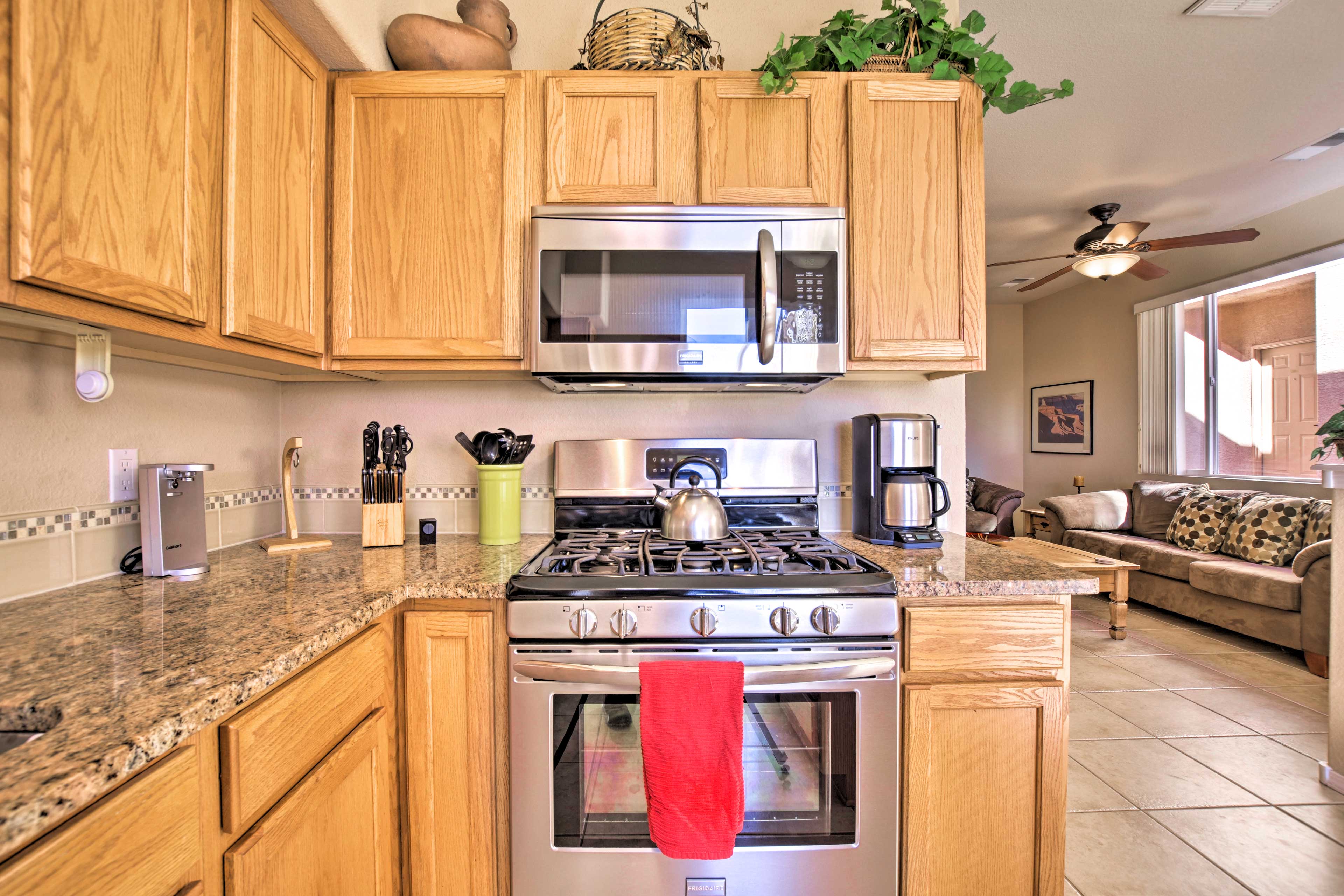 The kitchen is fully stocked with plenty of cookware & a bistro dining set.