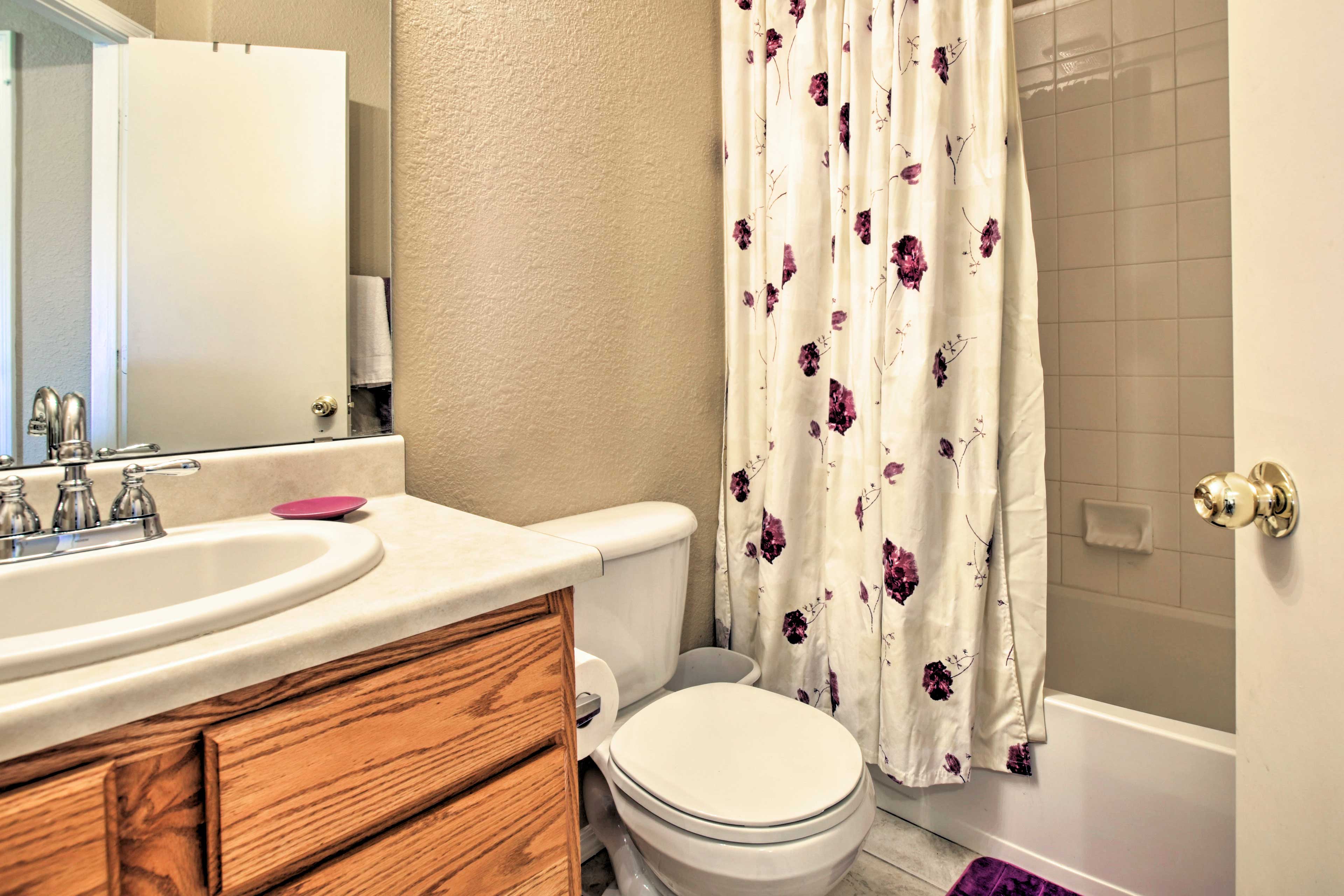 The second bathroom features a shower/tub combo.