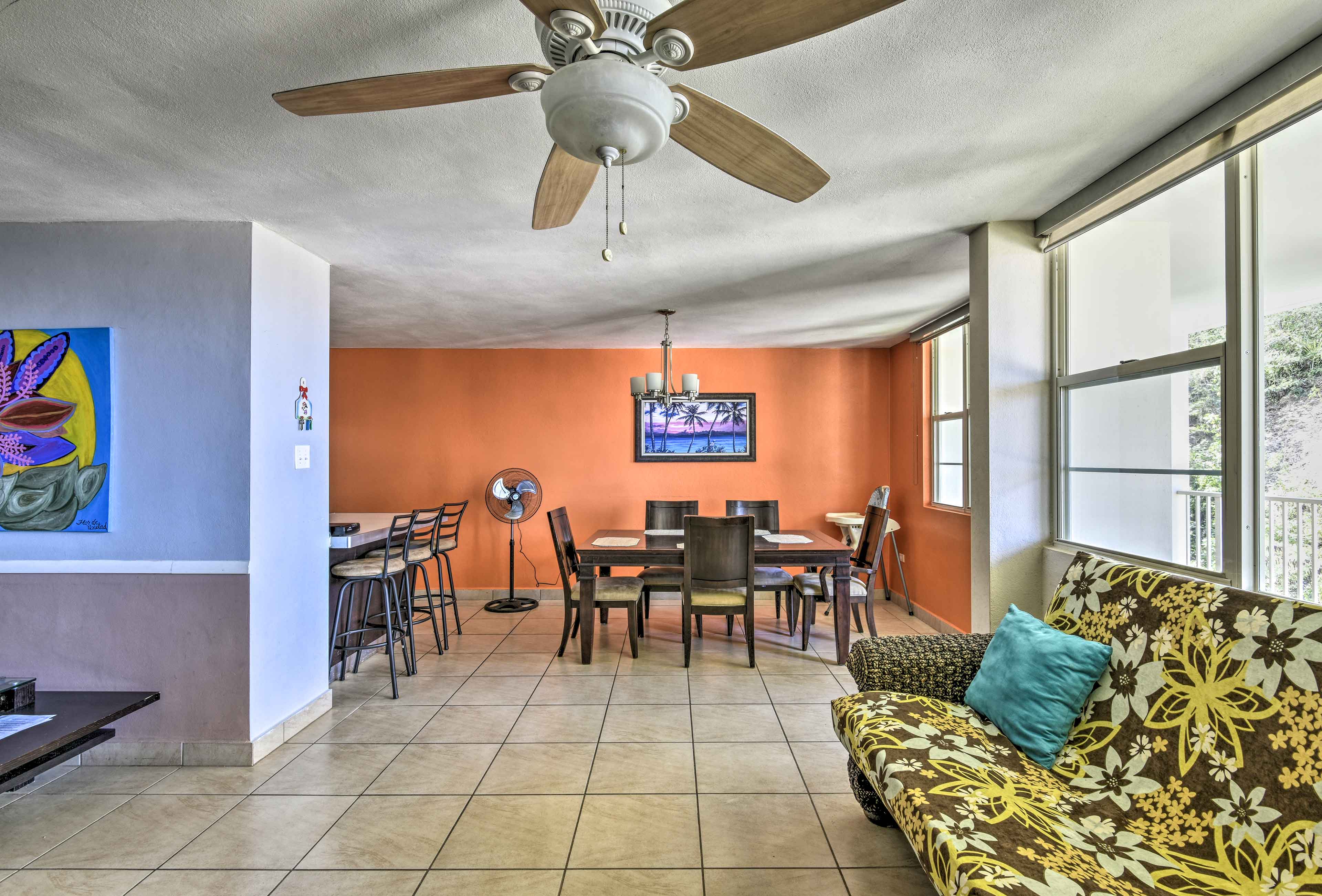 The wall of windows illuminates the condo's airy and open floor plan.