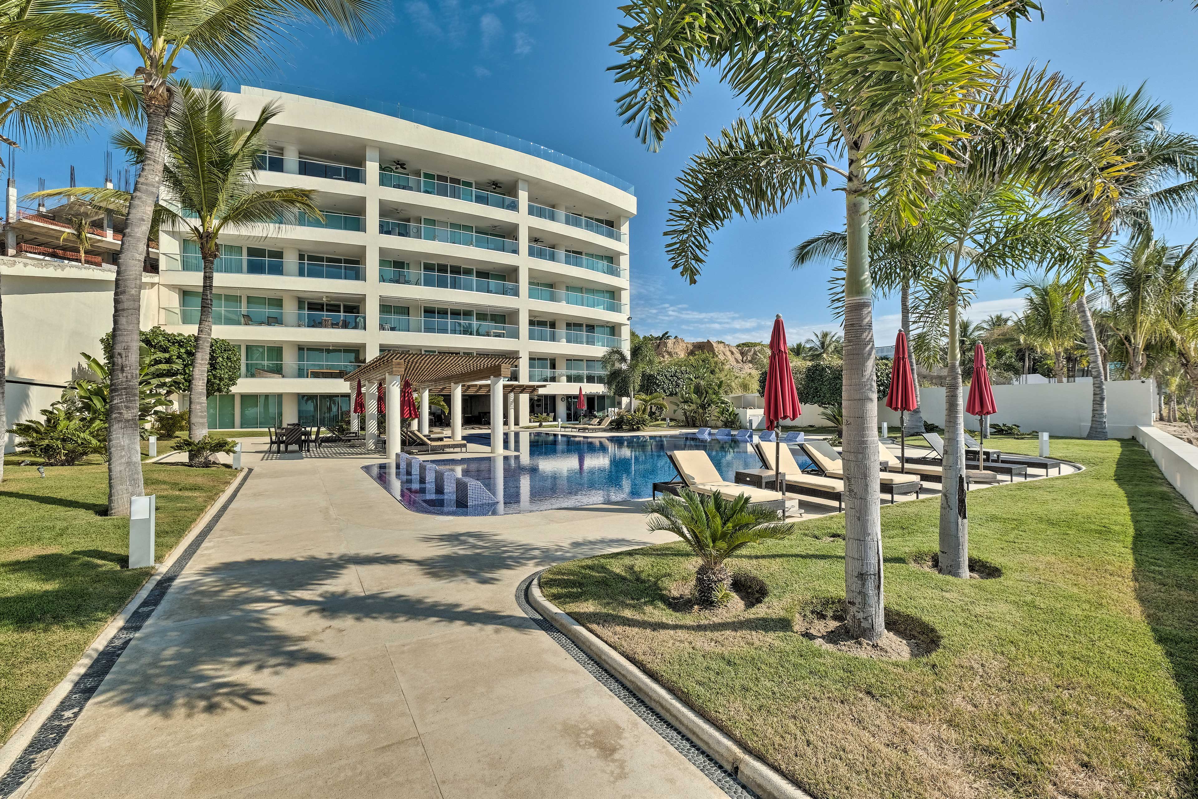 Claim a lounge chair and enjoy a nap amidst the tropical palms.