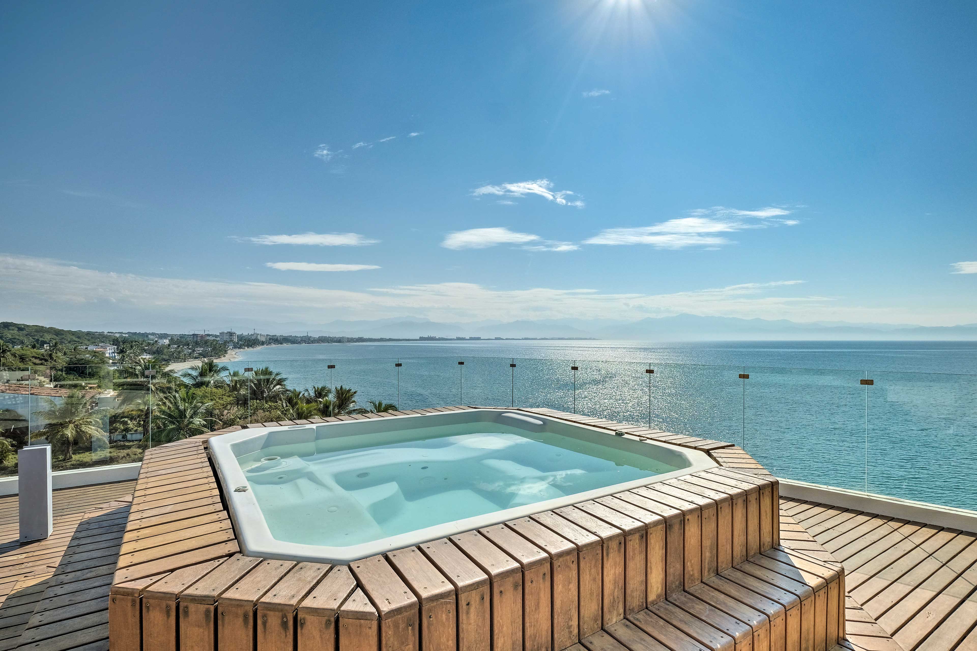 Soak in this rooftop hot tub while gazing out at the sparkling coastal waters.