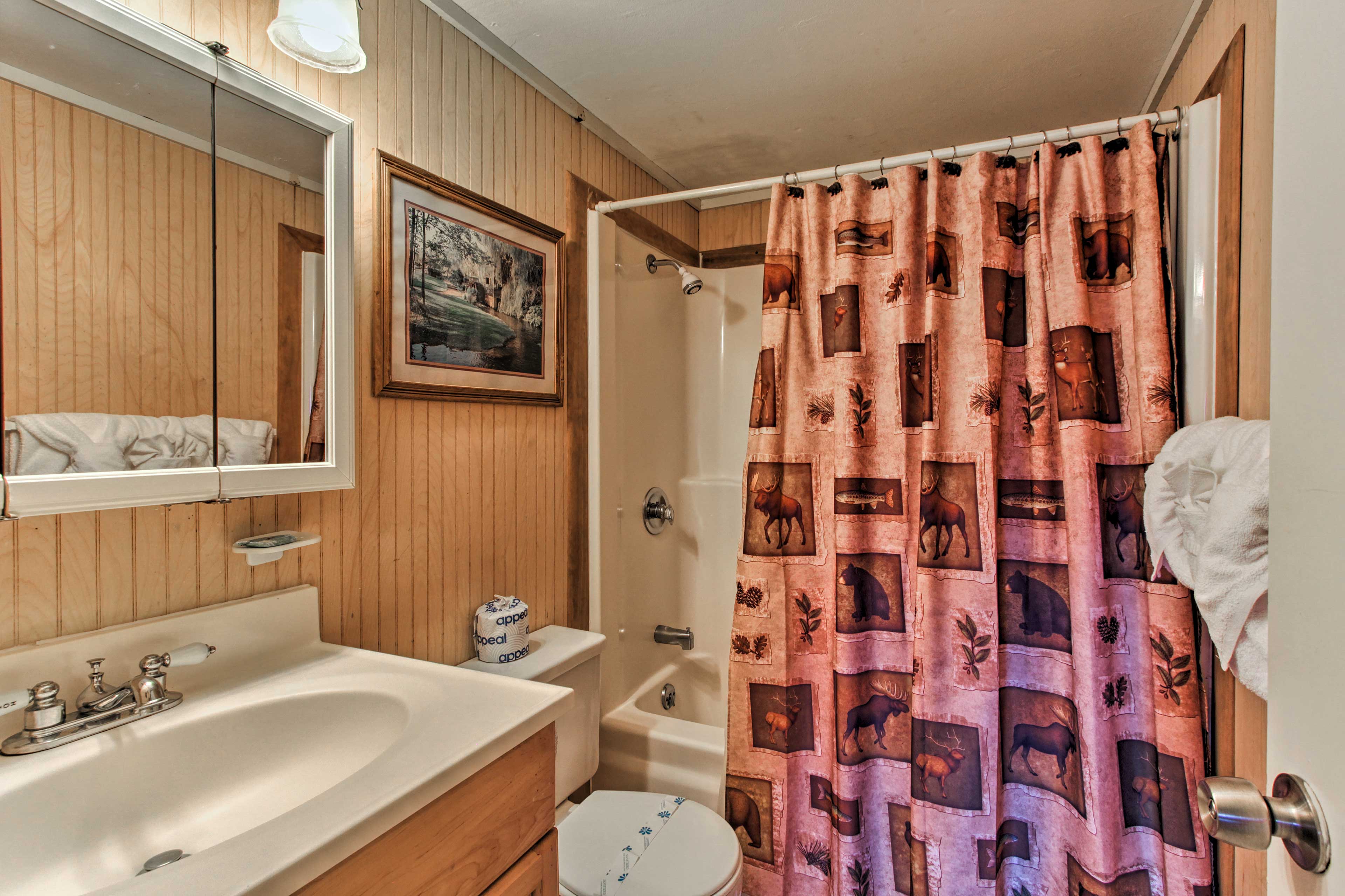 Another shower/tub combo can be found in the second full bathroom.