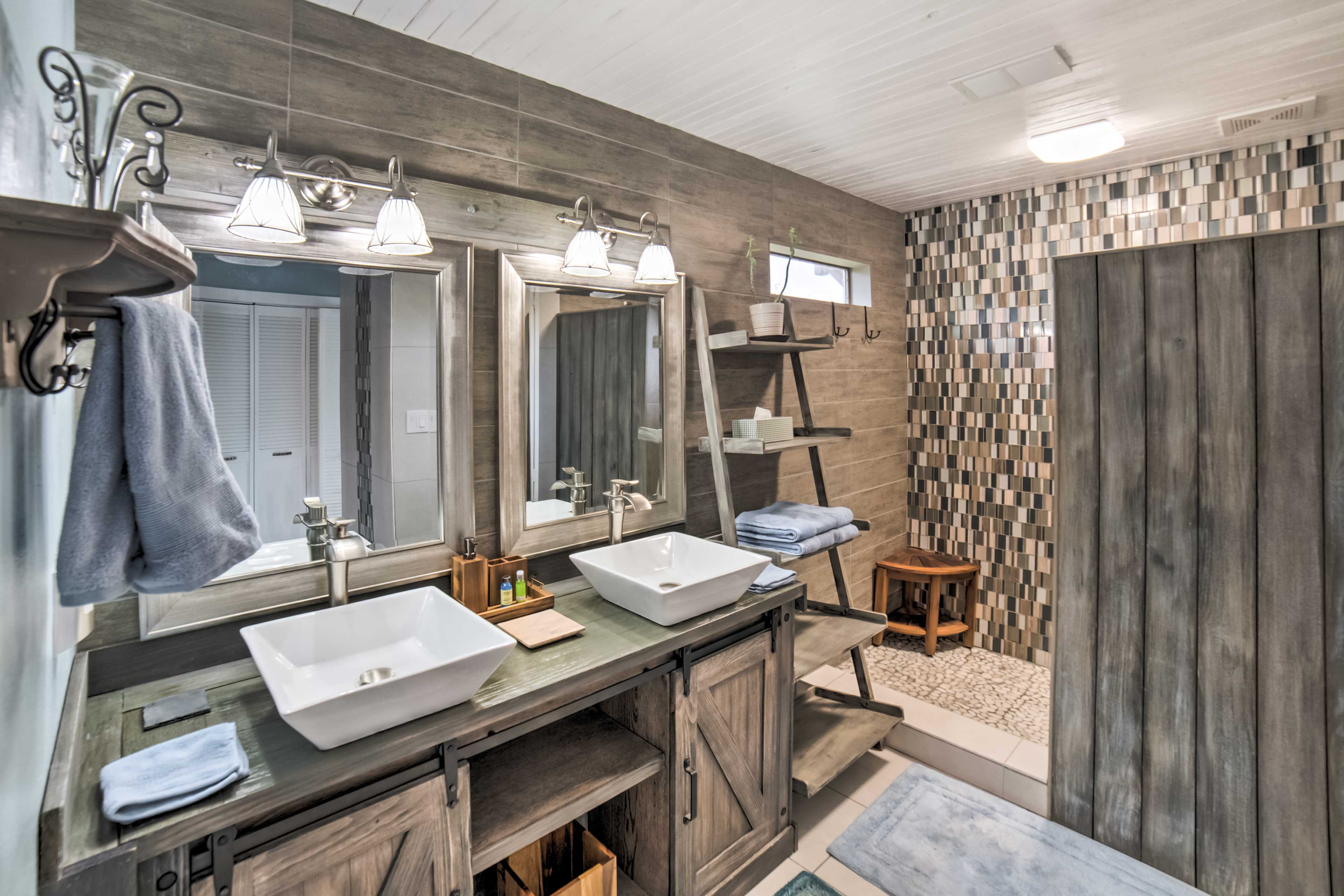 The en-suite bath features Jack-and-Jill sinks and a large walk-in shower.