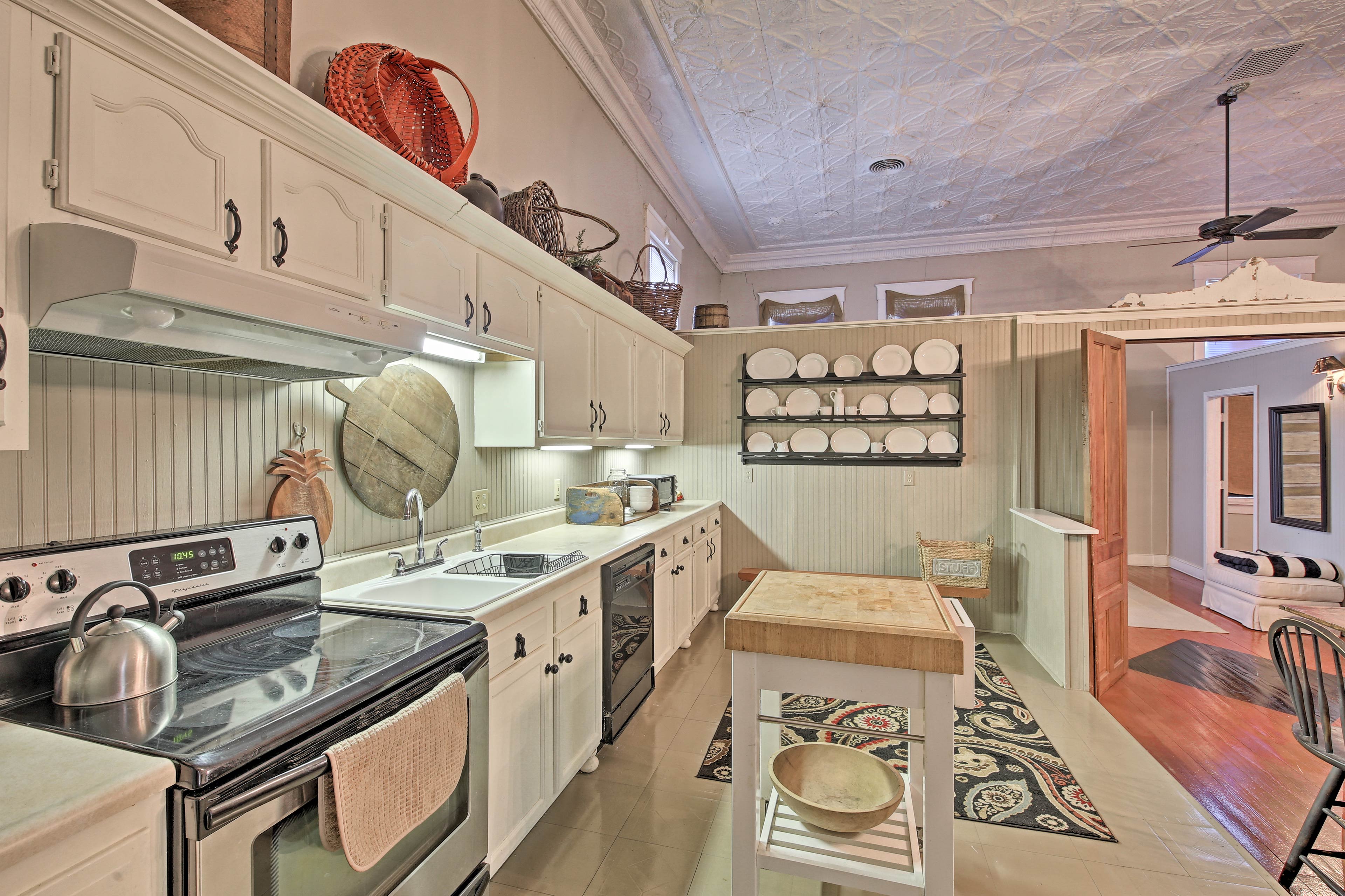 Step over to the fully equipped kitchen to begin meal preparations.