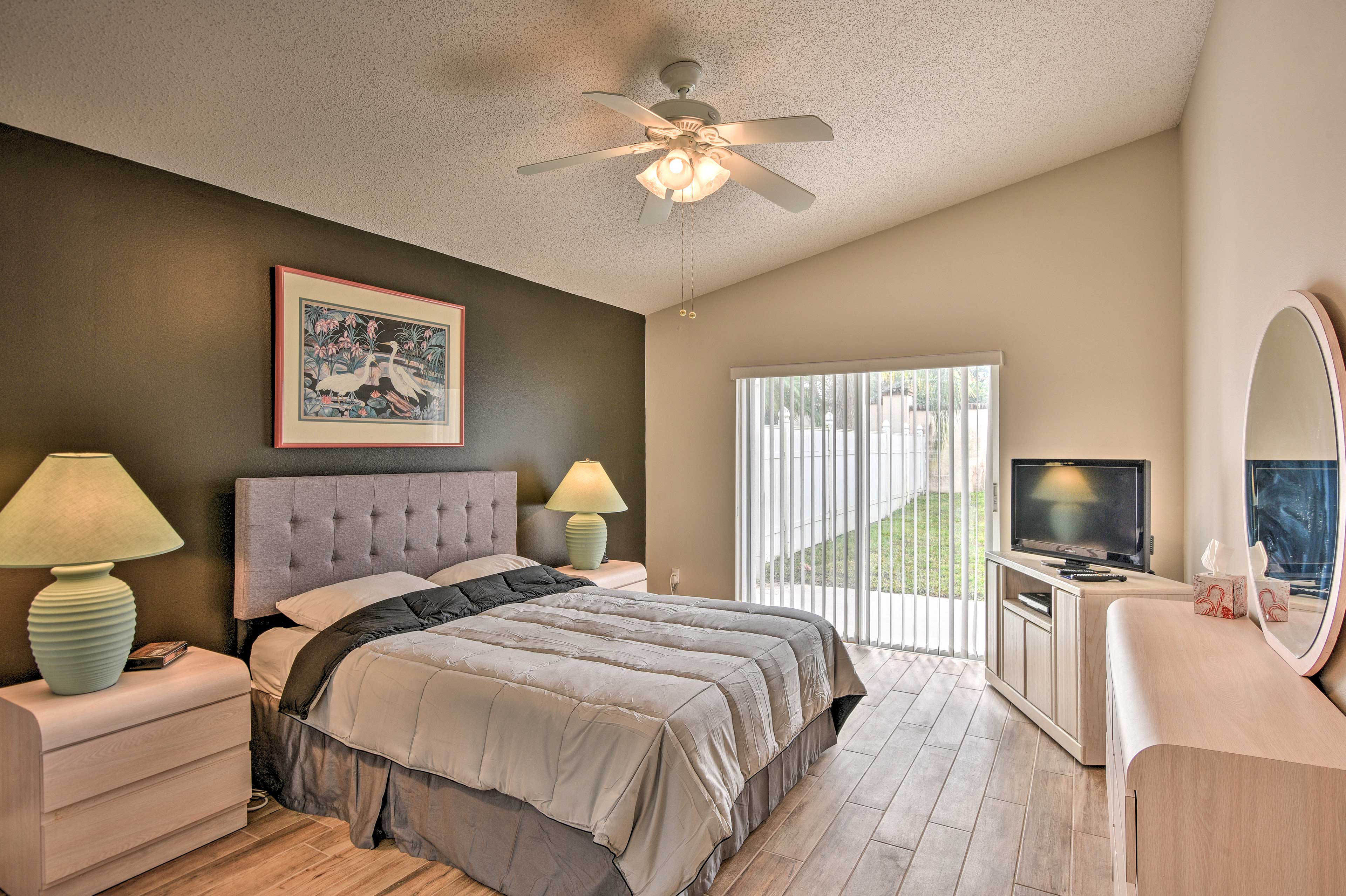 Bedroom 1 features a king bed and patio access.