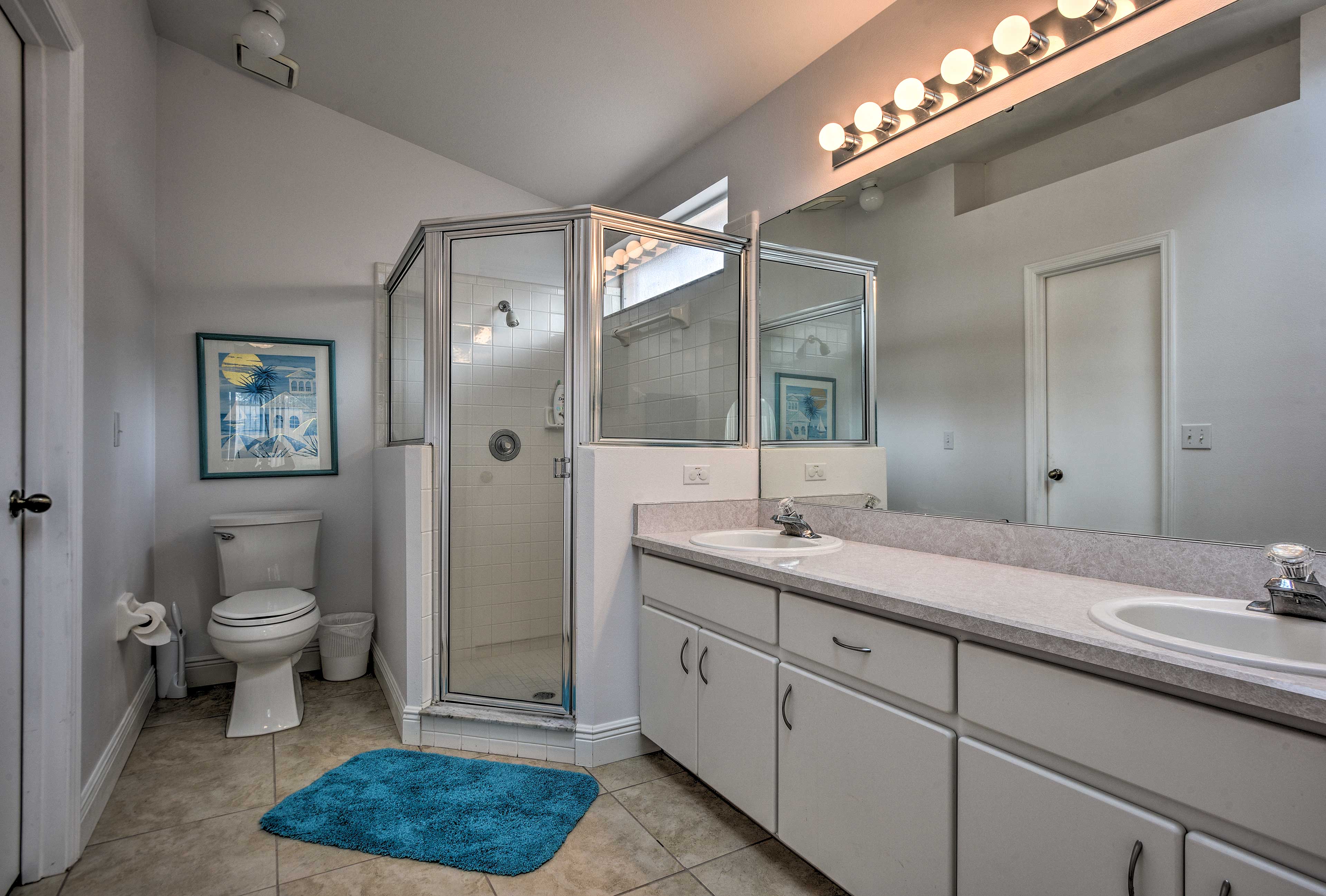 The en-suite bath boasts a spacious shower.