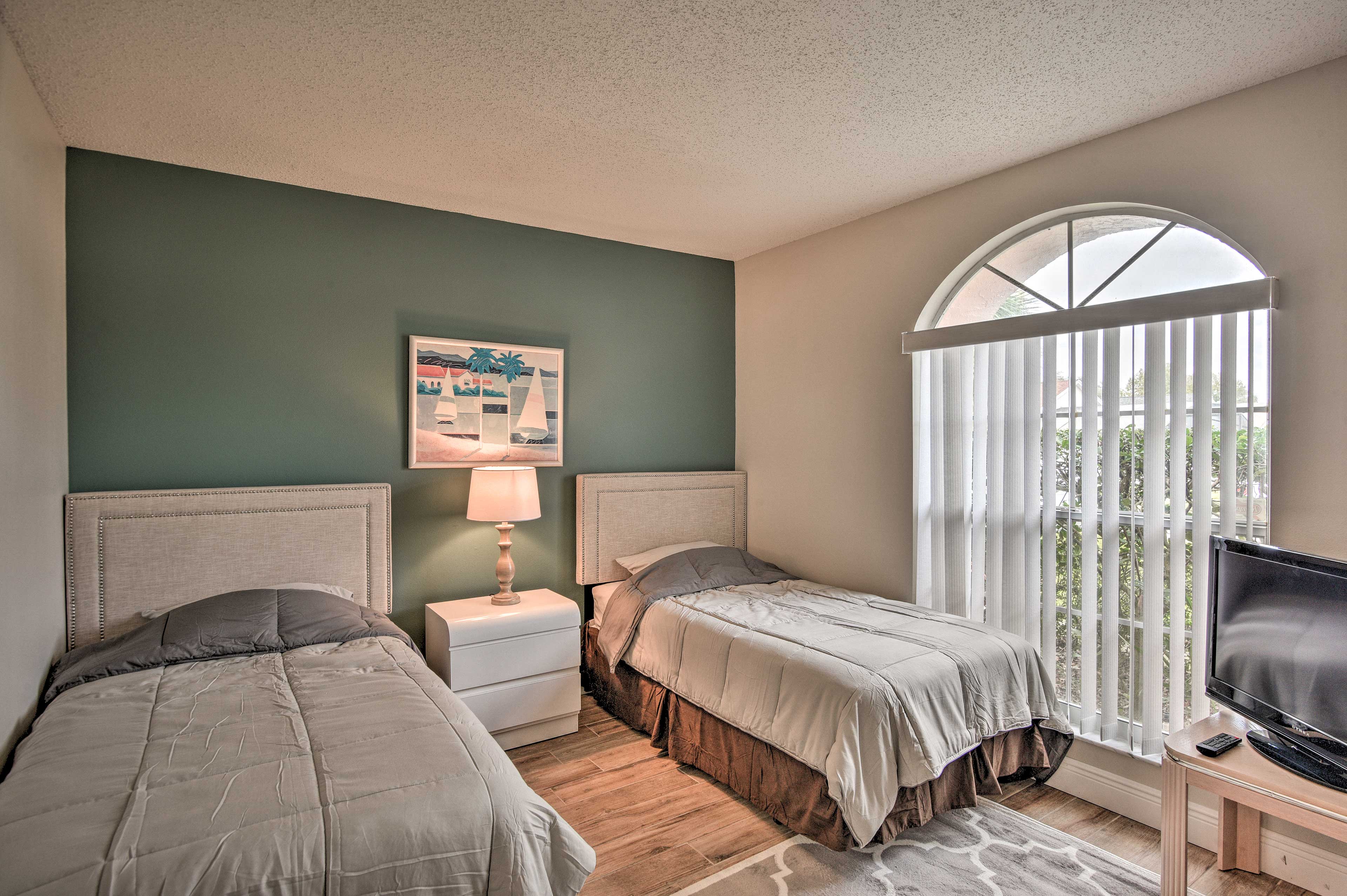 Ideal for kids, the third bedroom features 2 twin beds.