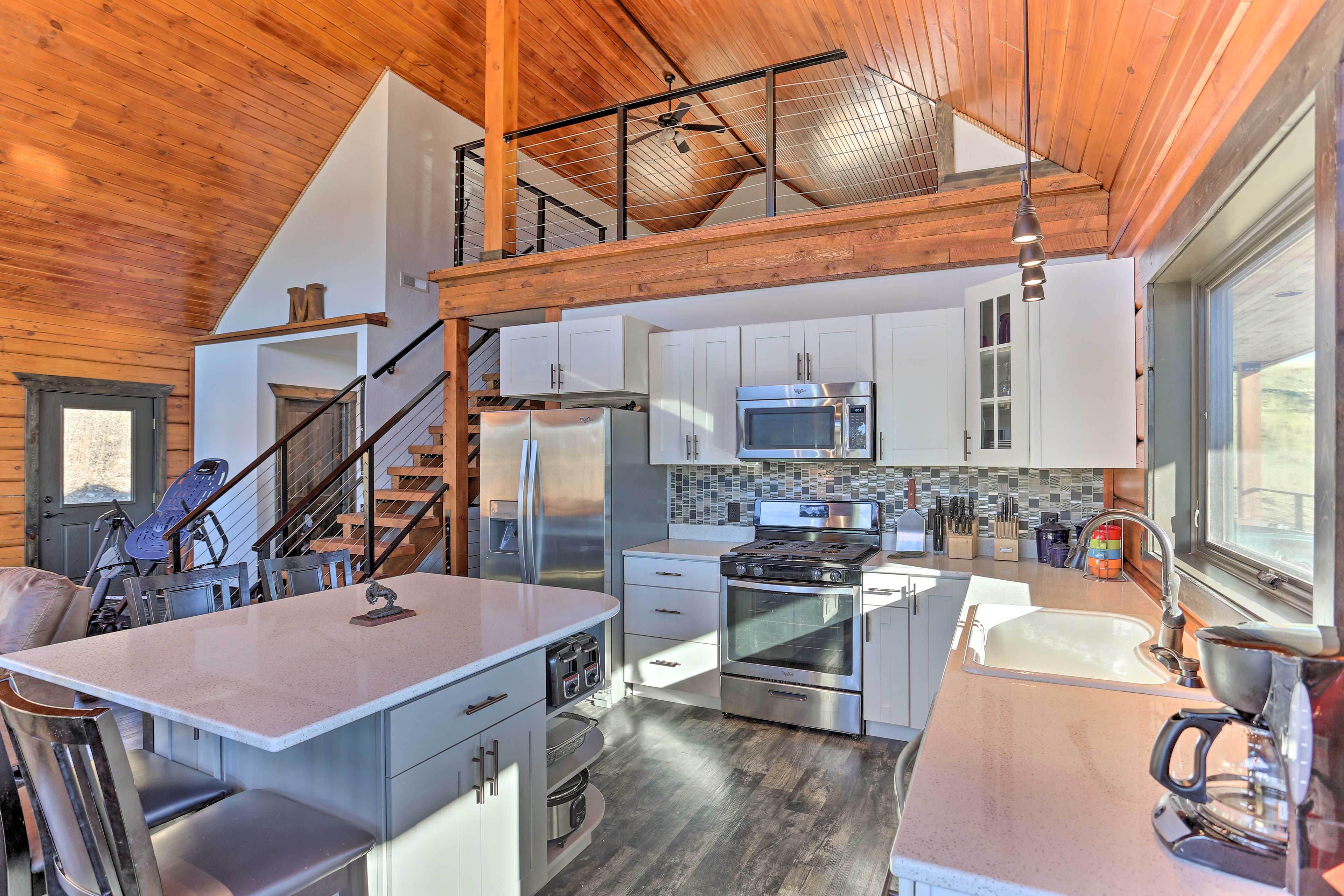 The fully equipped kitchen features stainless steel appliances.