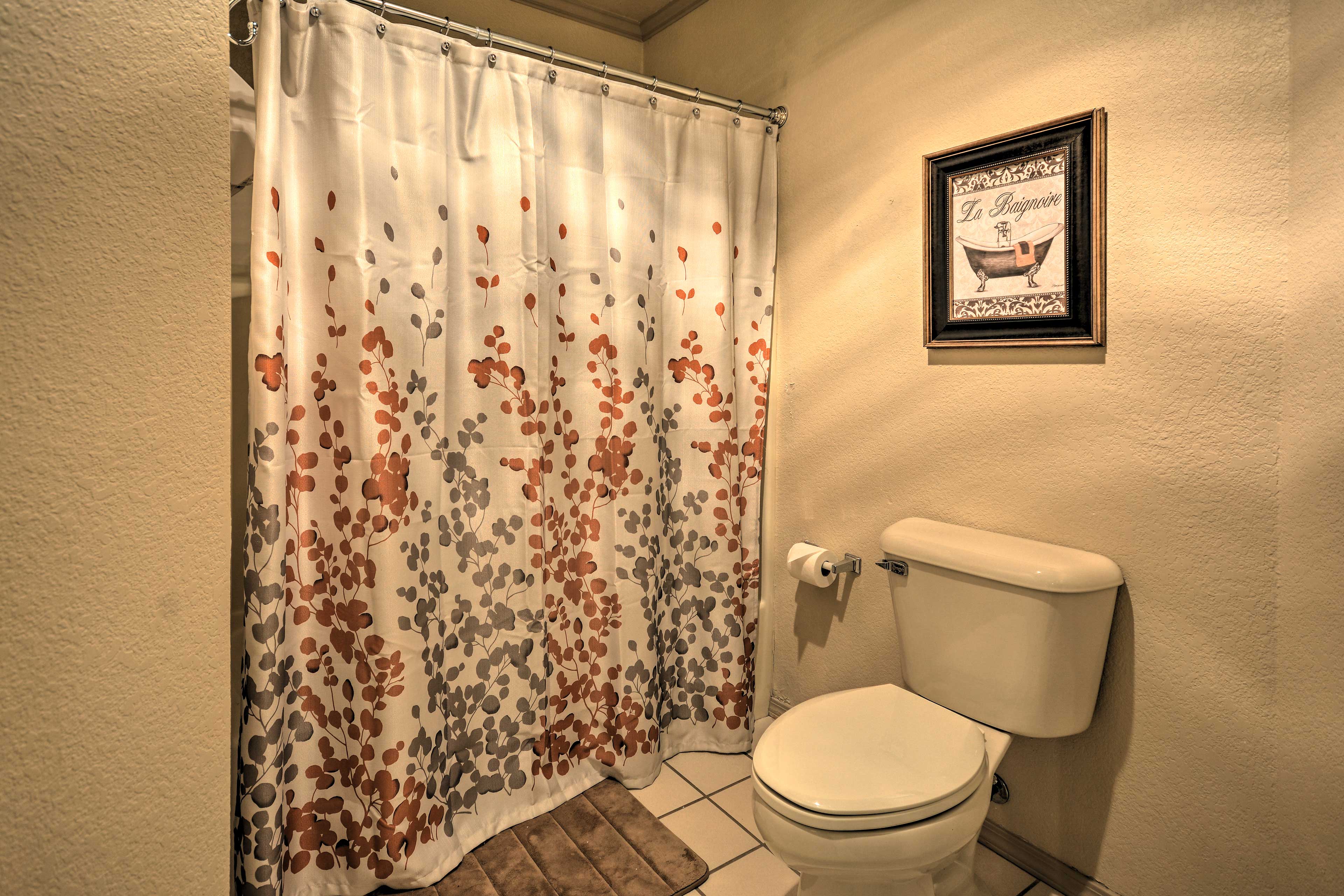 The bathroom includes a shower/tub combo.