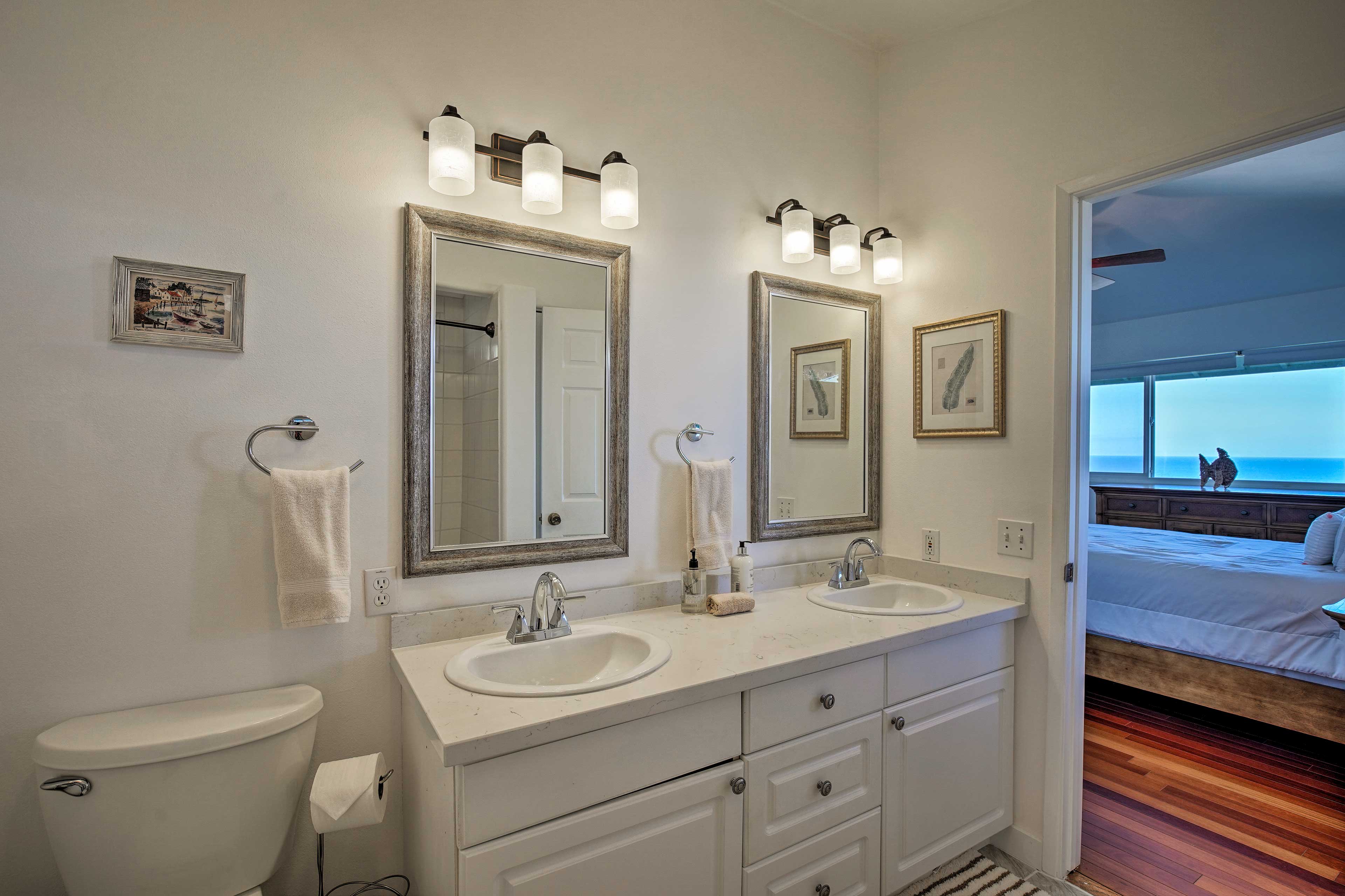 This bedroom features an elegant en-suite bathroom.