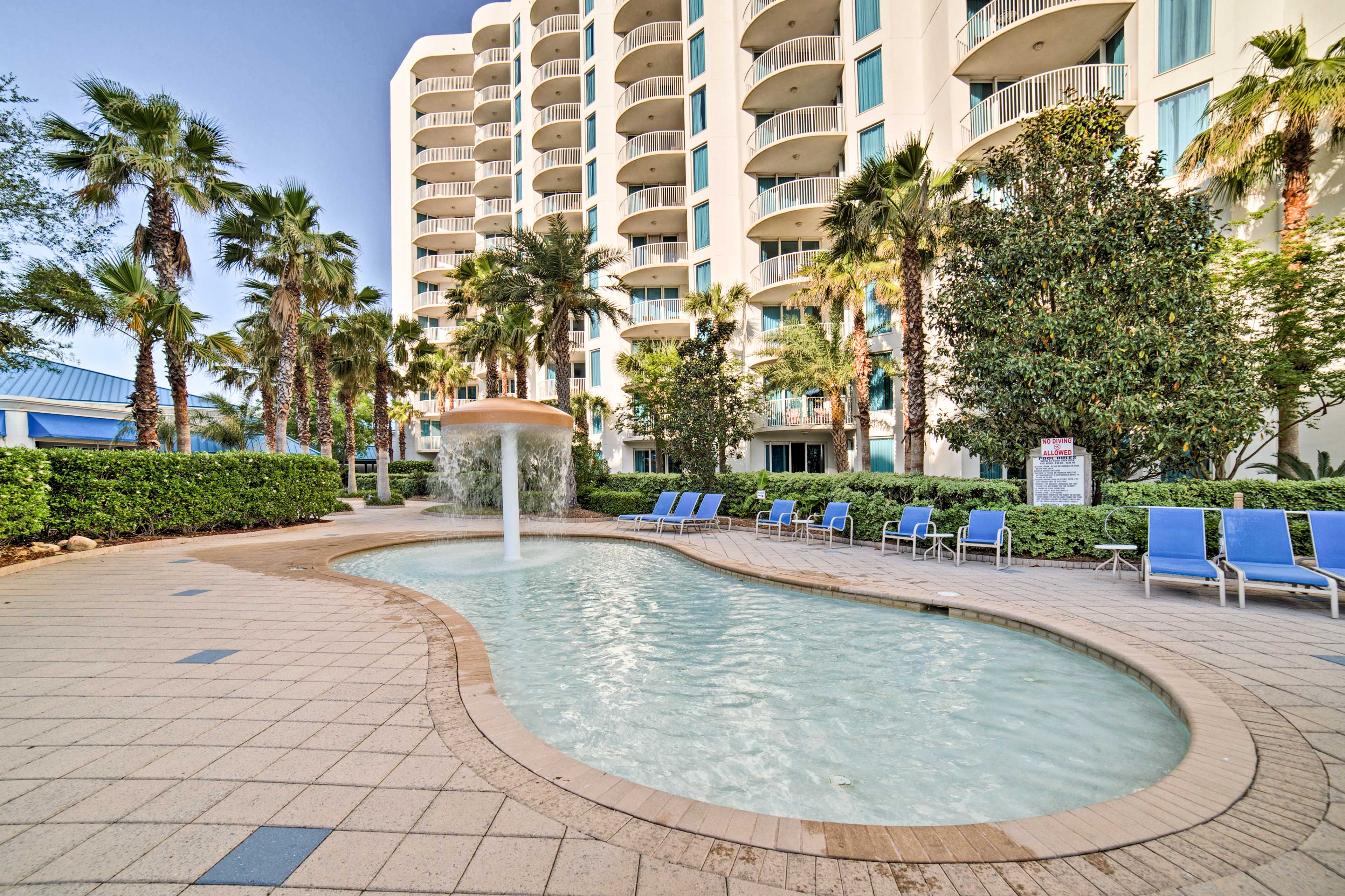 Kids will love running beneath the flowing waterfall in the shallow kiddie pool.