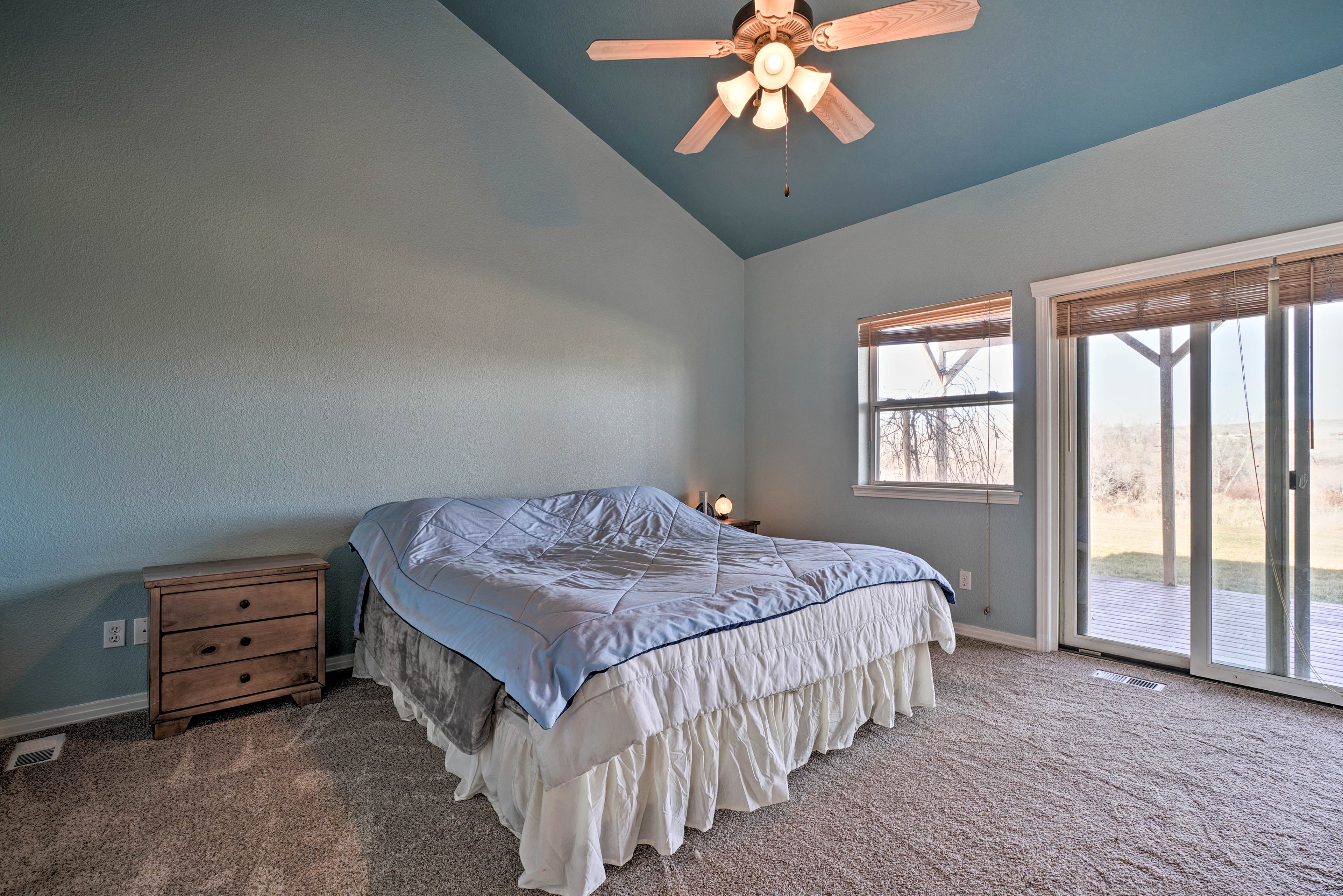 The primary bedroom features a king-sized bed.