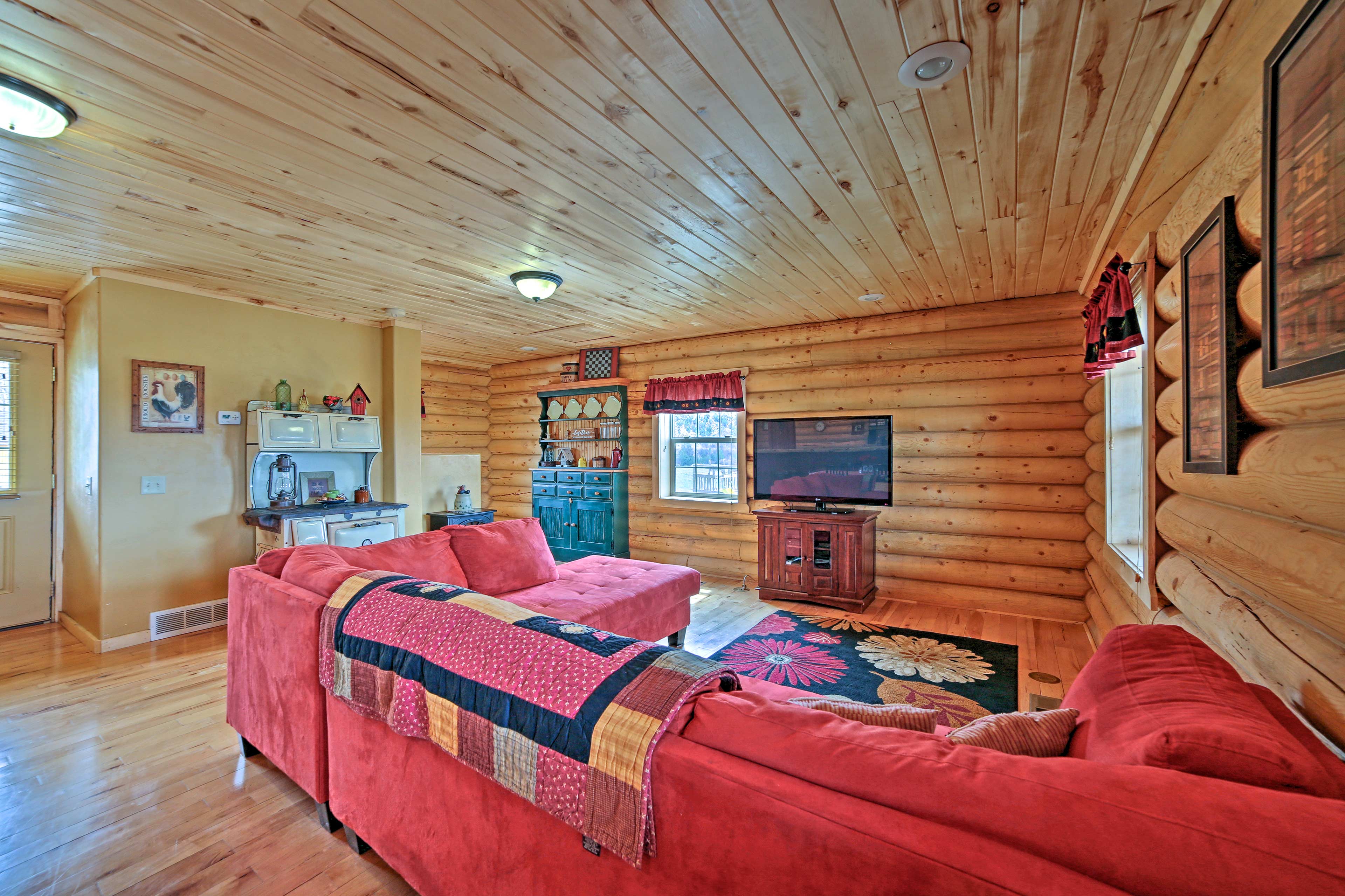 Natural light pours across the hardwood floors of the spacious open floor plan.