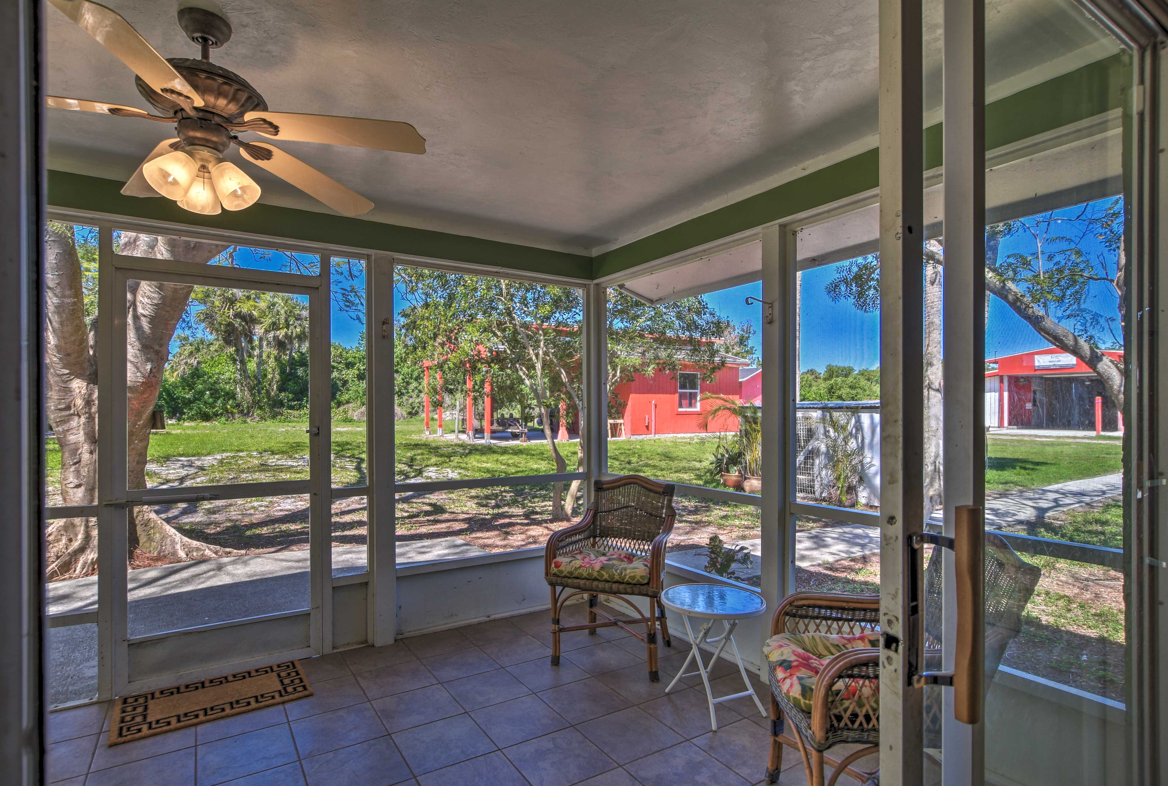 Step out onto the screened-in porch to sip a cocktail.