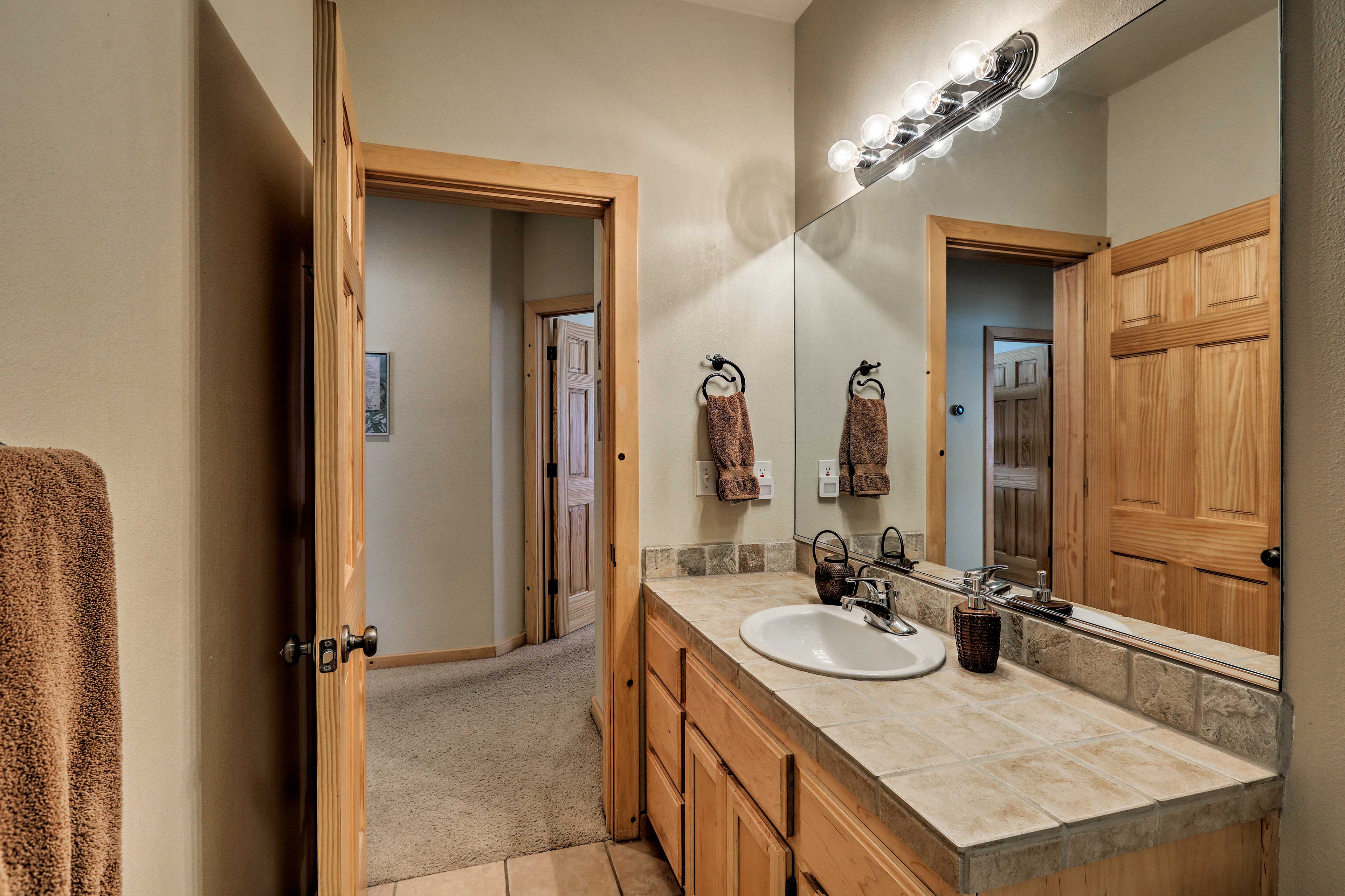 Ample counter space makes it easy to get ready in this bathroom.