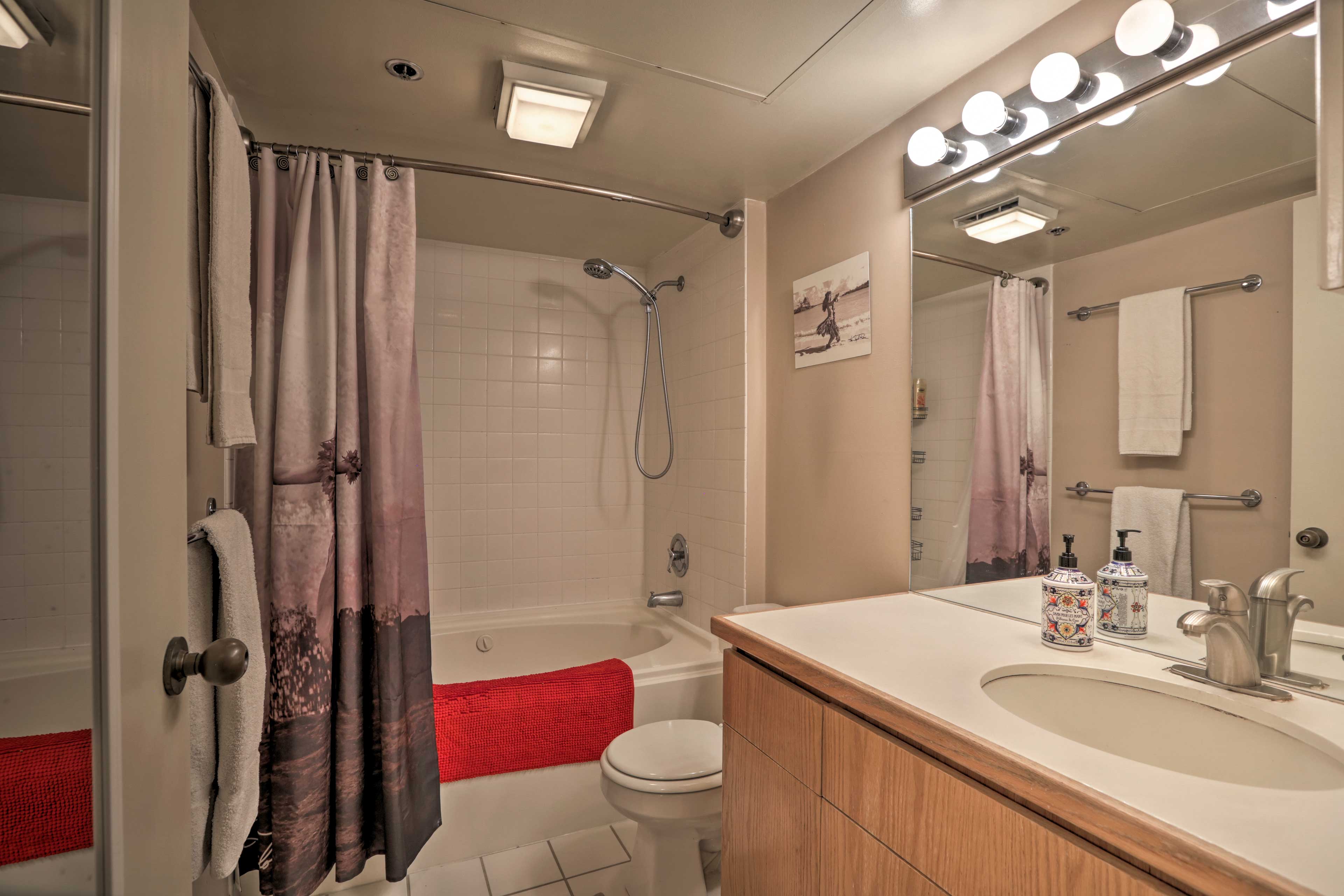 The en-suite bathroom has a shower/tub combo.