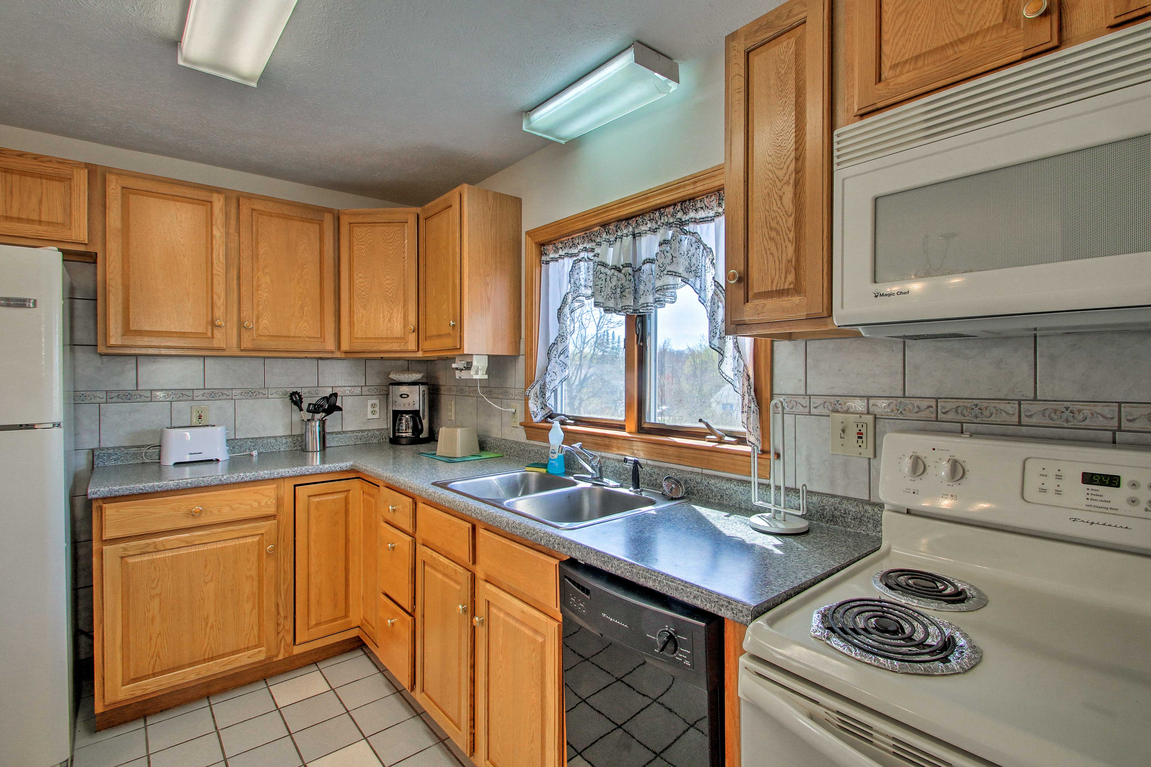 The kitchen features all appliances necessary.