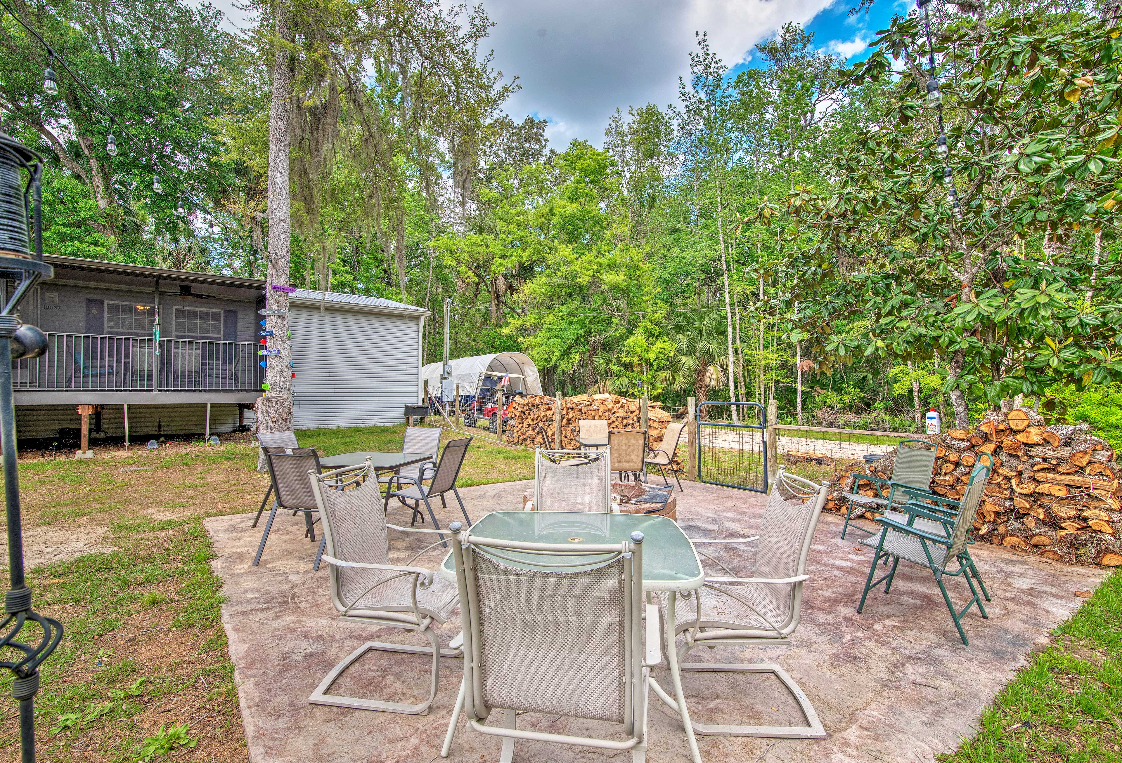 The back patio has a dining area and fire pit.