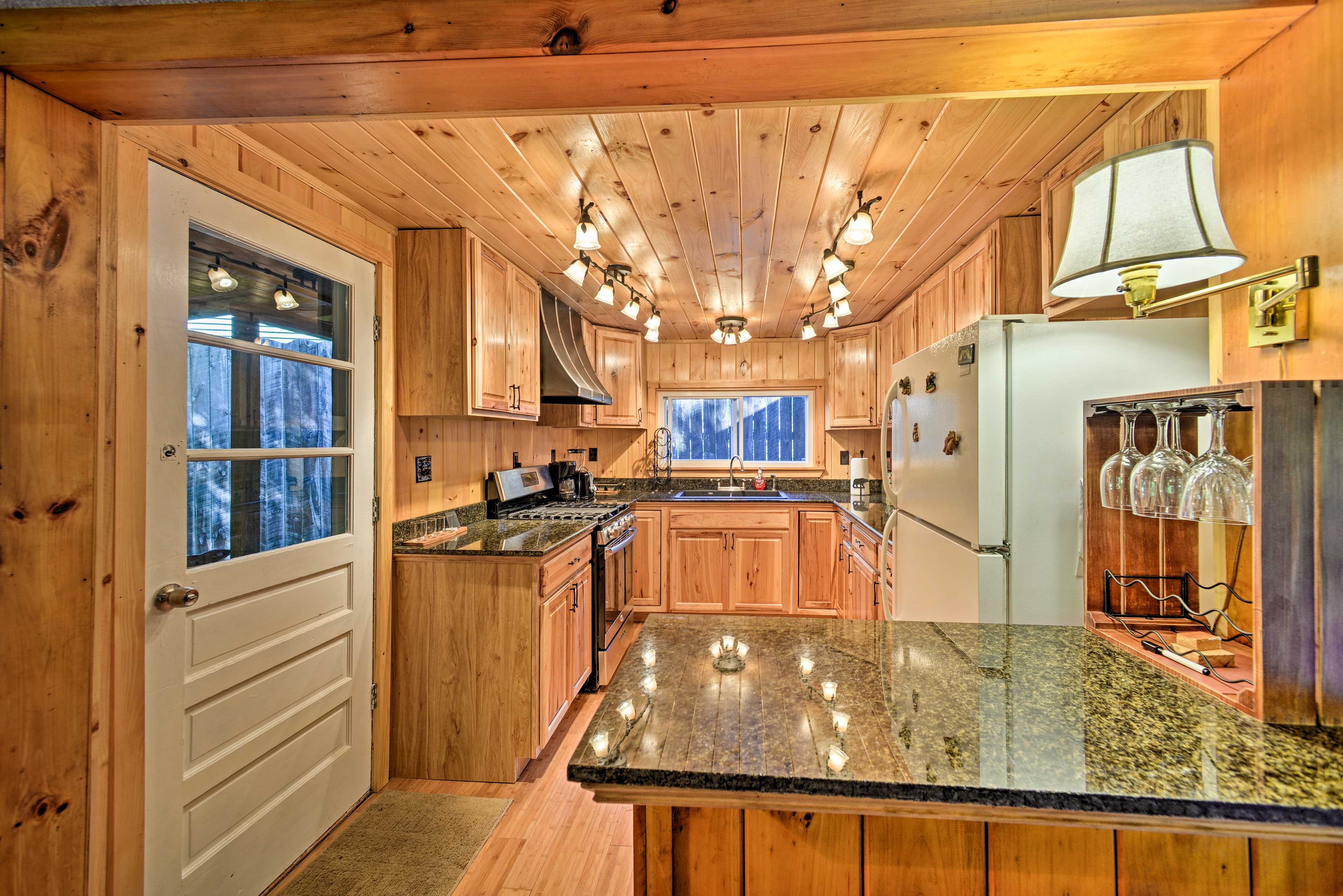 Granite-topped counters outfit the well-equipped kitchen!