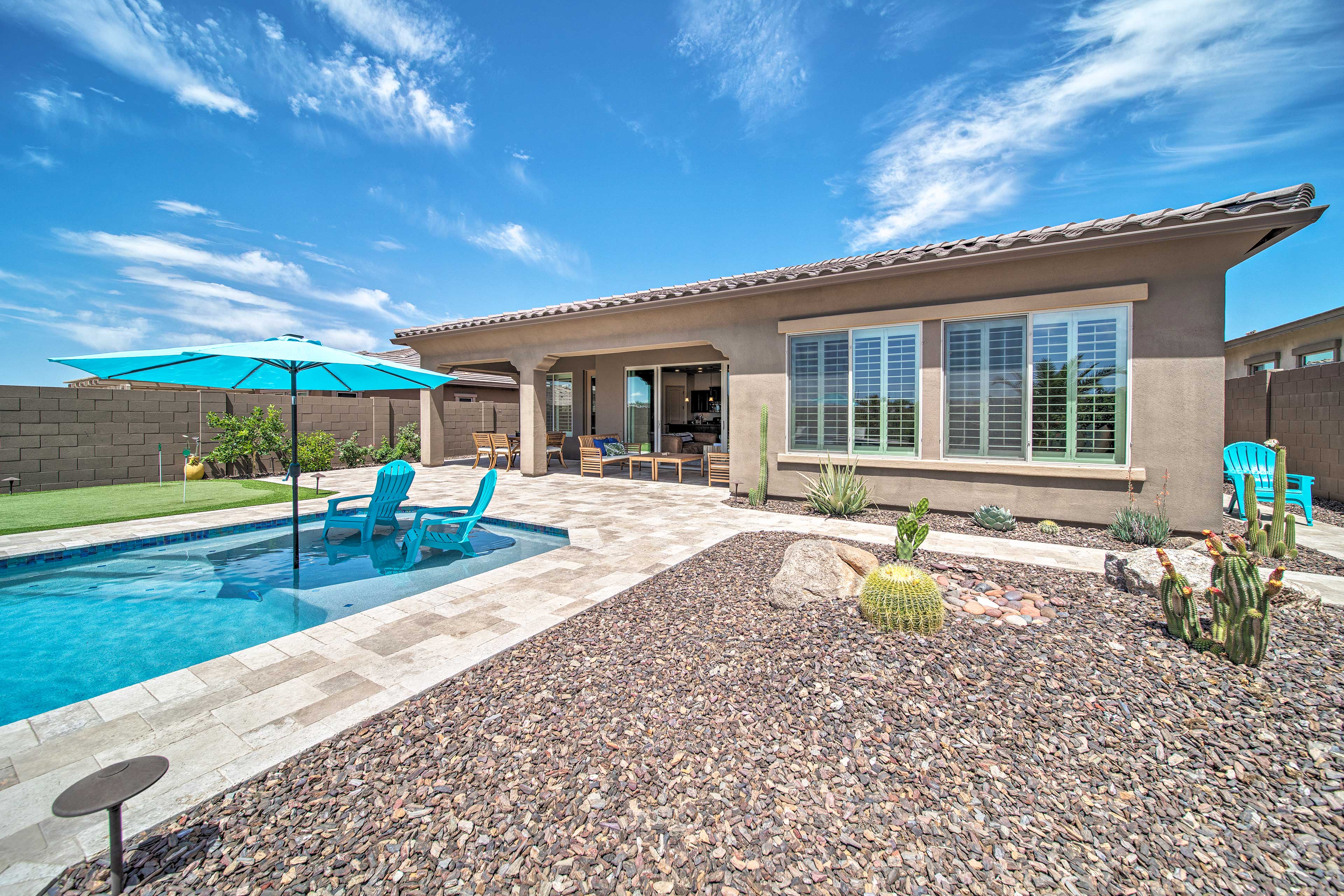 Desert landscaping surrounds the home.