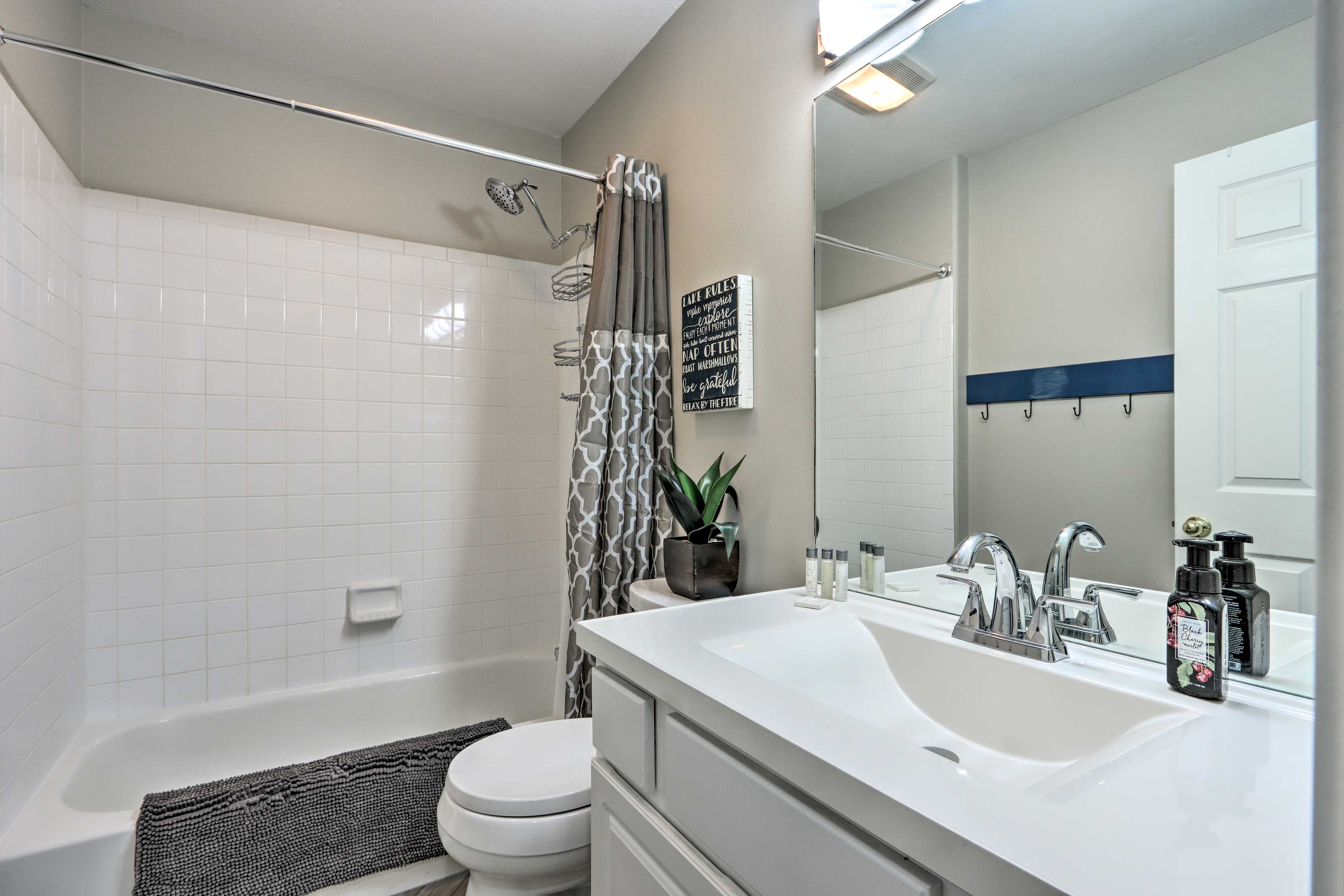 This bathroom also provides a shower/tub combo.