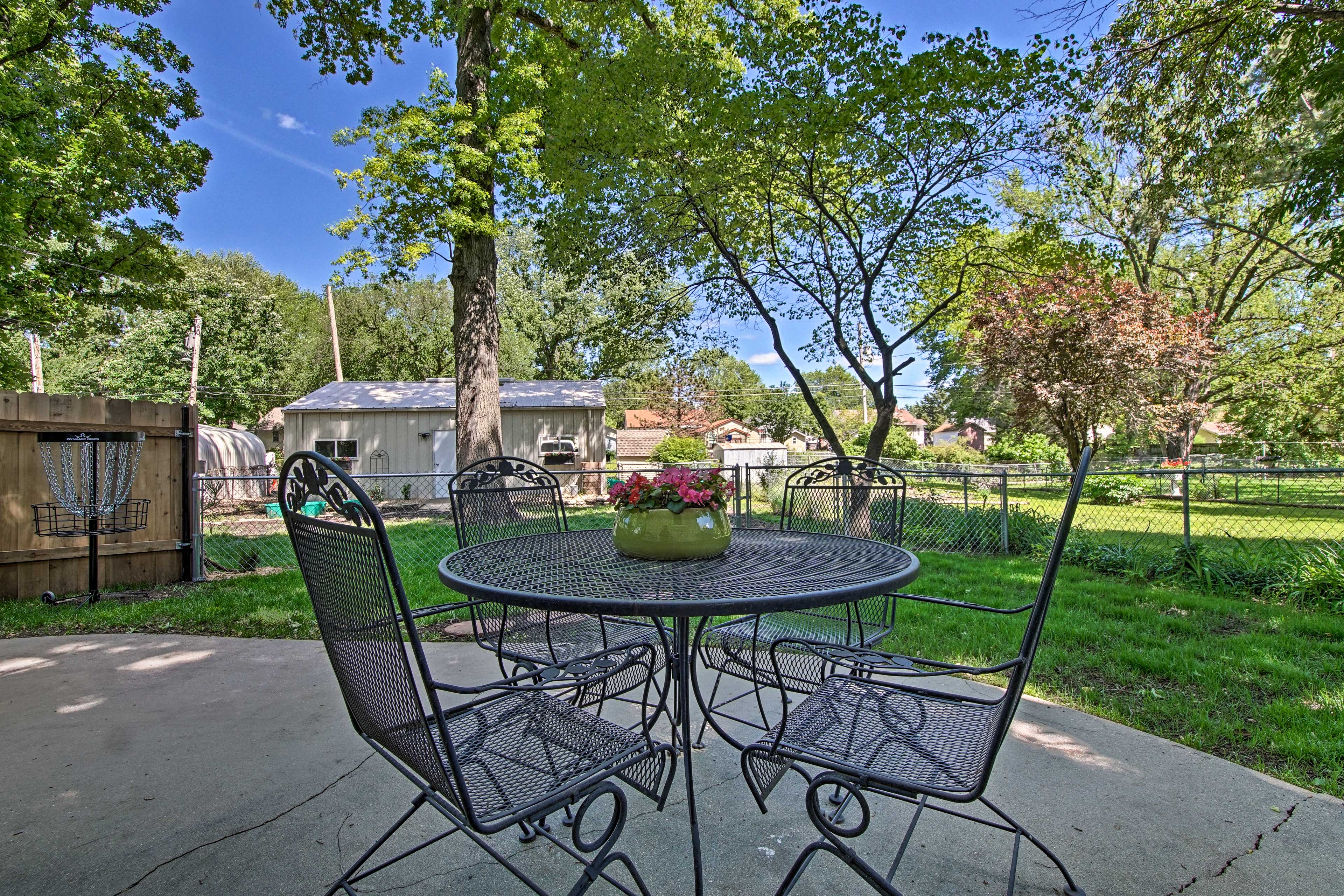 The patio includes a quaint 4-person table.