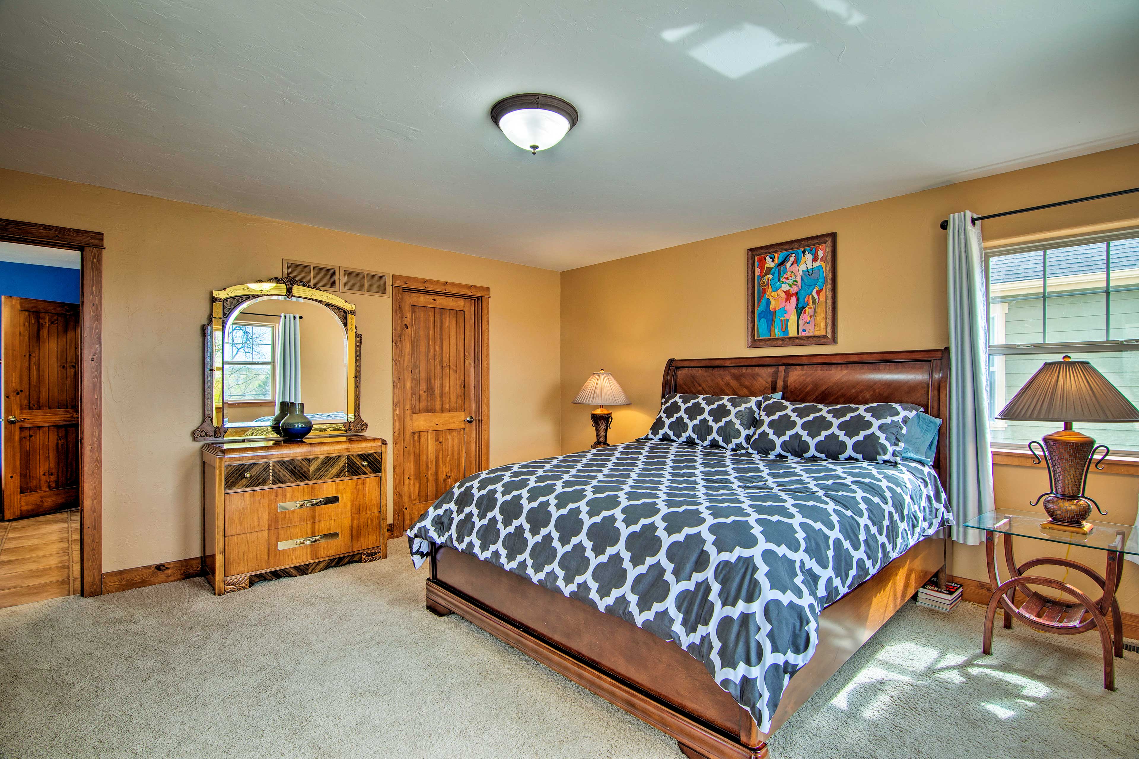 The bedroom boasts a king-sized bed.