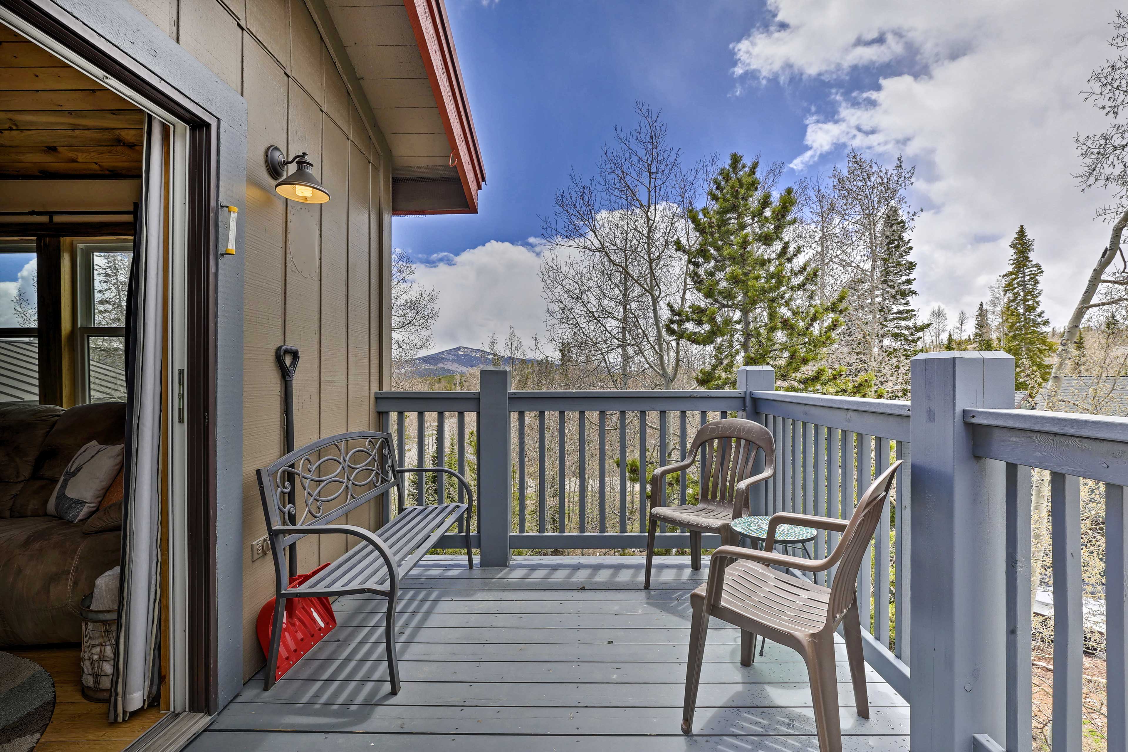 The deck is located off the living room.