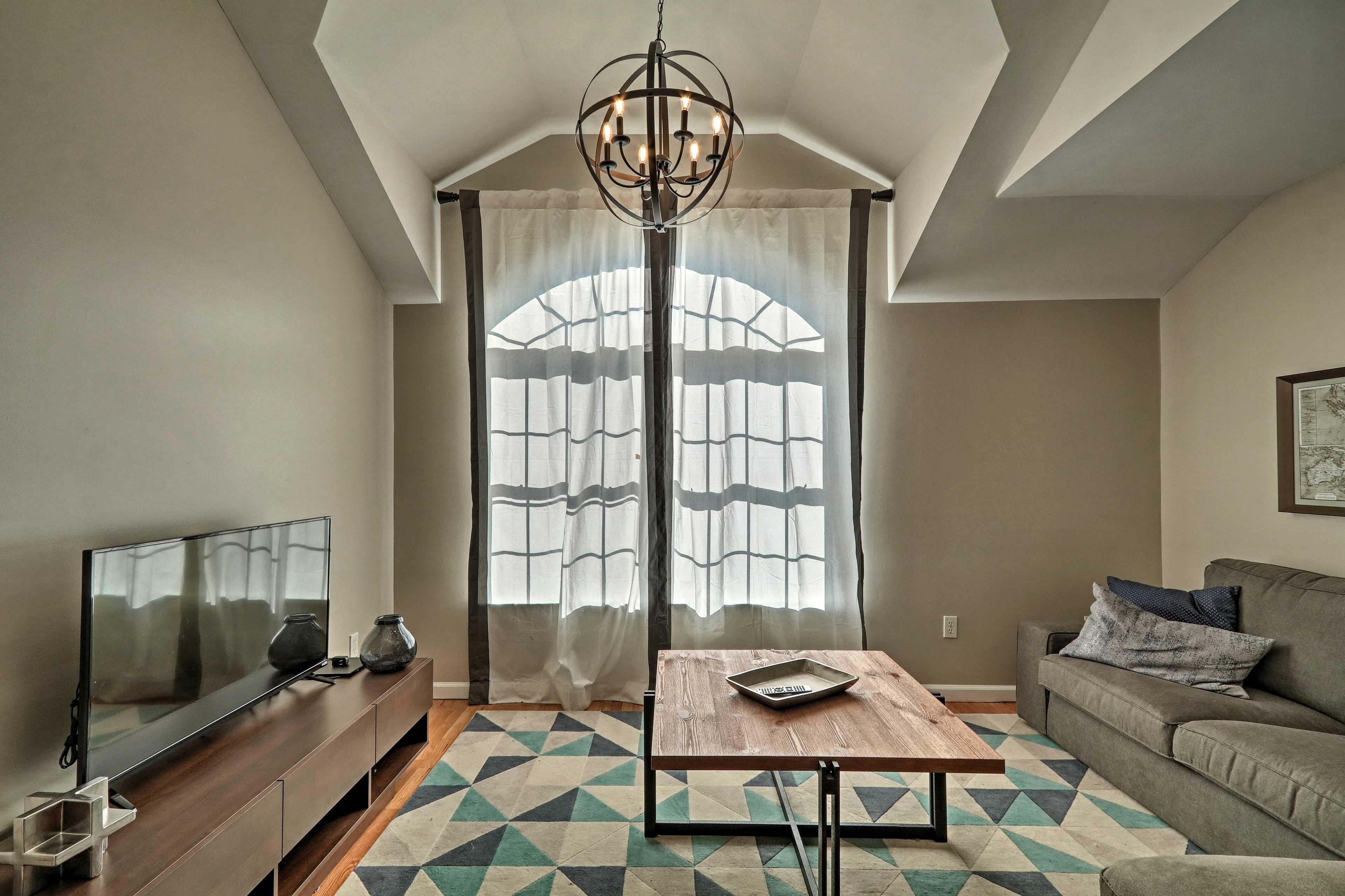 The floor-to-ceiling window allows plenty of natural light to fill the room.