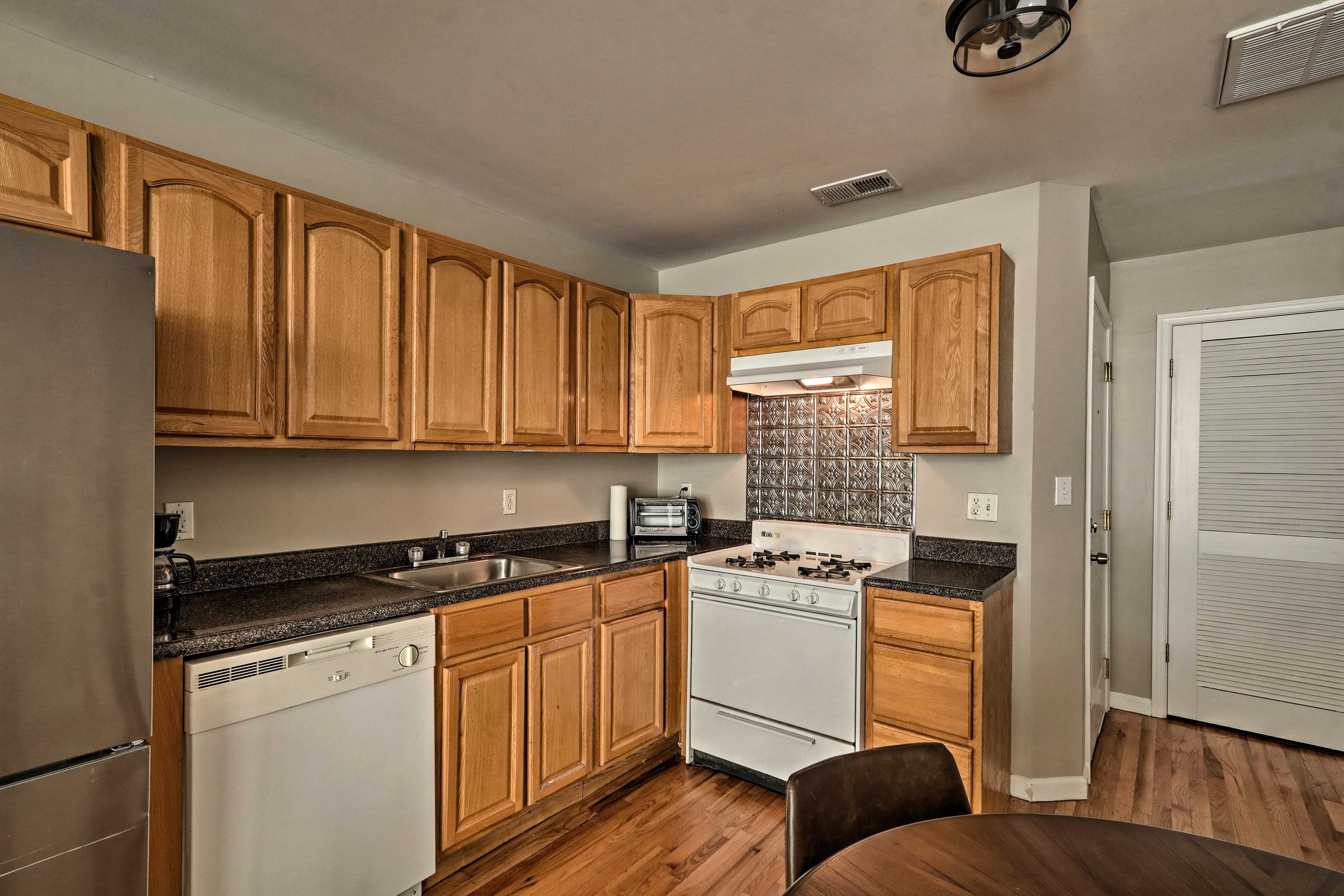 Wraparound counters hold appliances including a coffee maker and toaster oven.