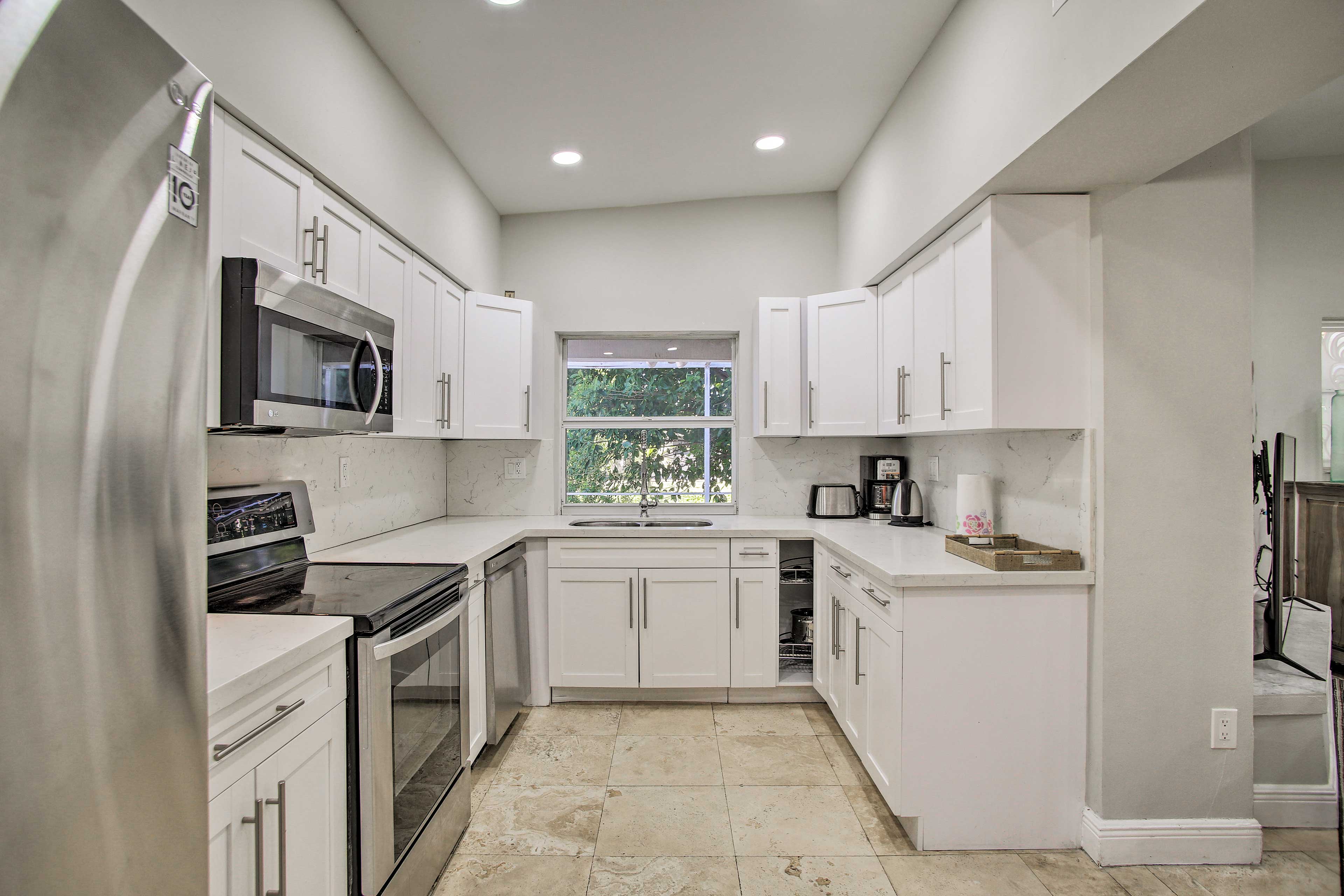 The kitchen is fully equipped with stainless steel appliances.