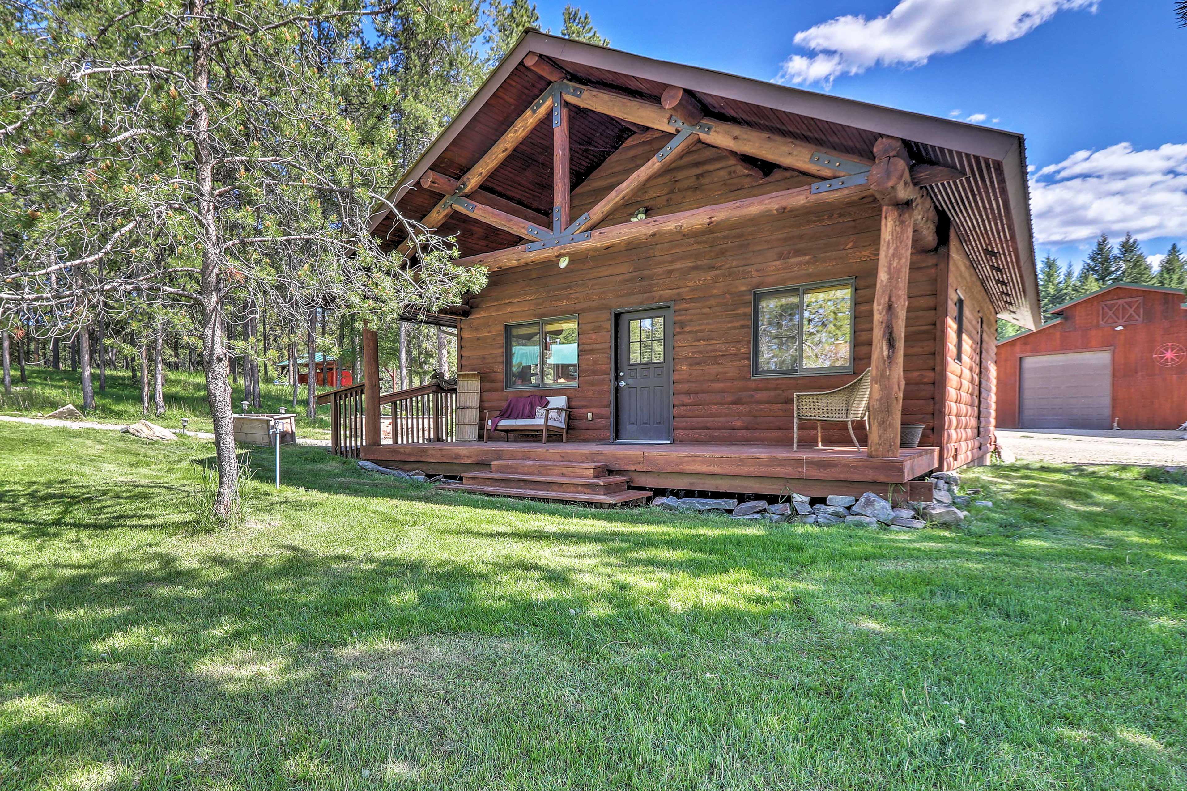 This 1-bedroom, 1-bath vacation rental cabin is nestled on a 40-acre ranch!