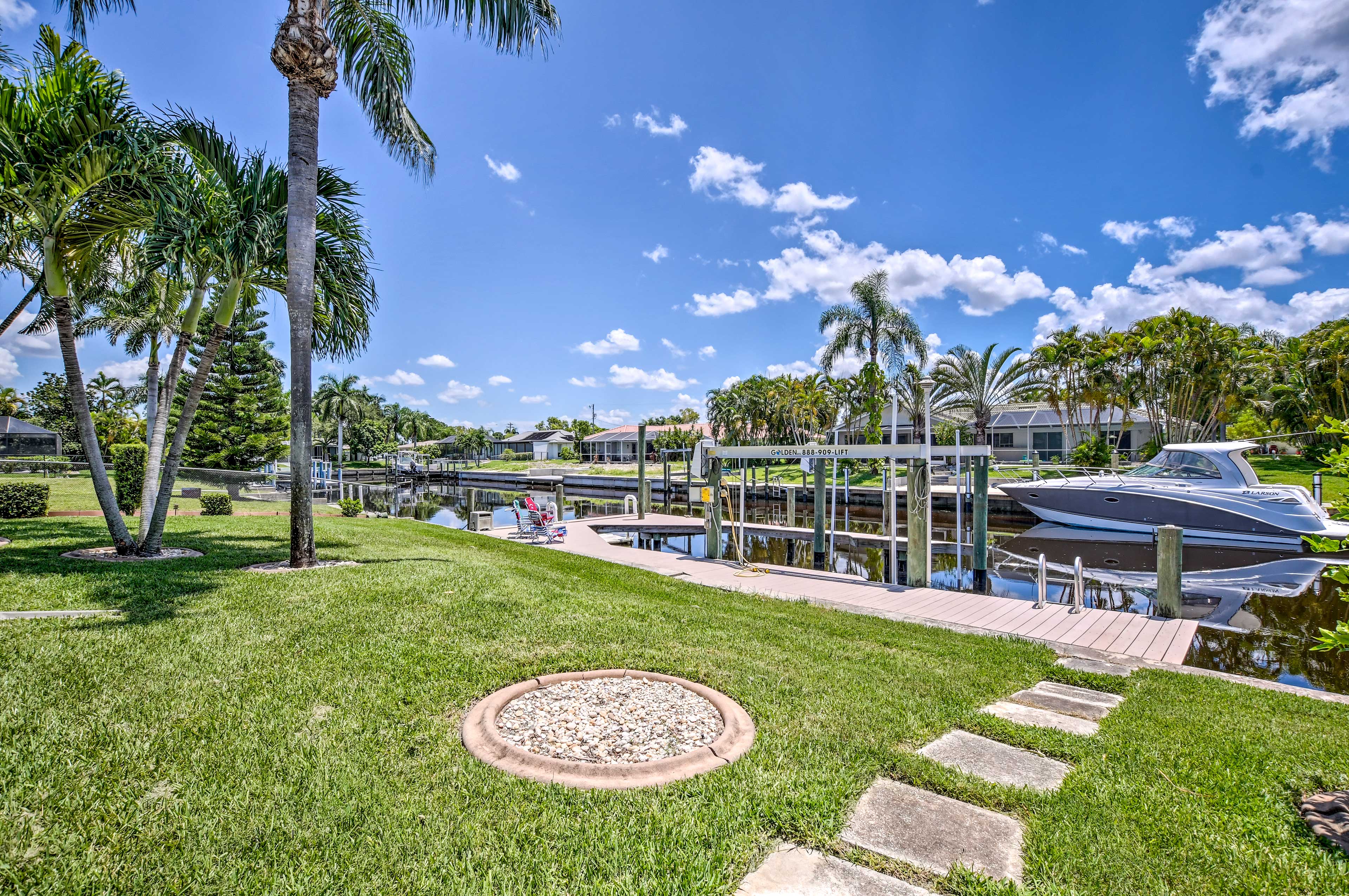 Relish in the waterfront and palm tree views.