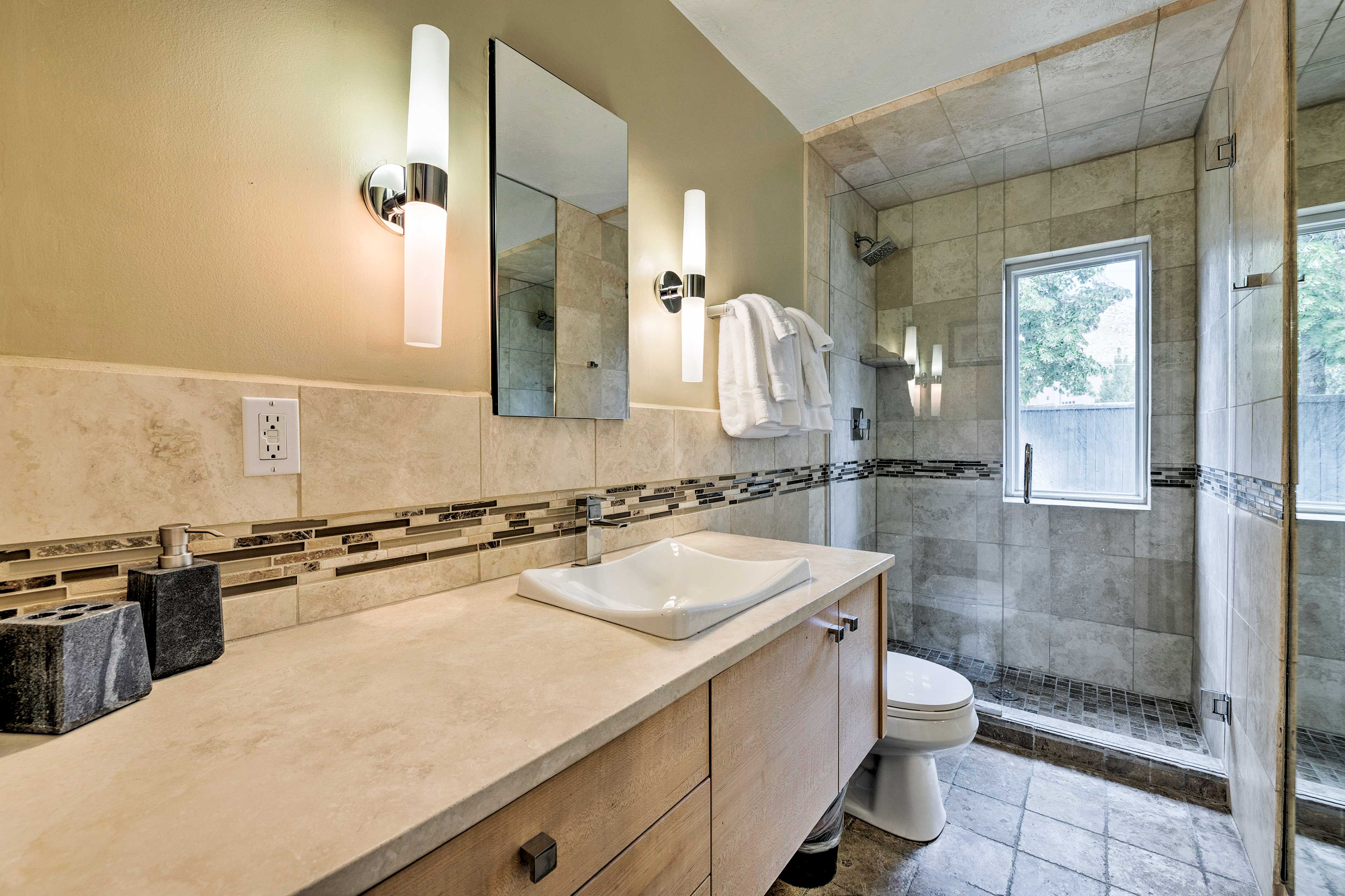 The first full bathroom is equipped with a walk-in shower.