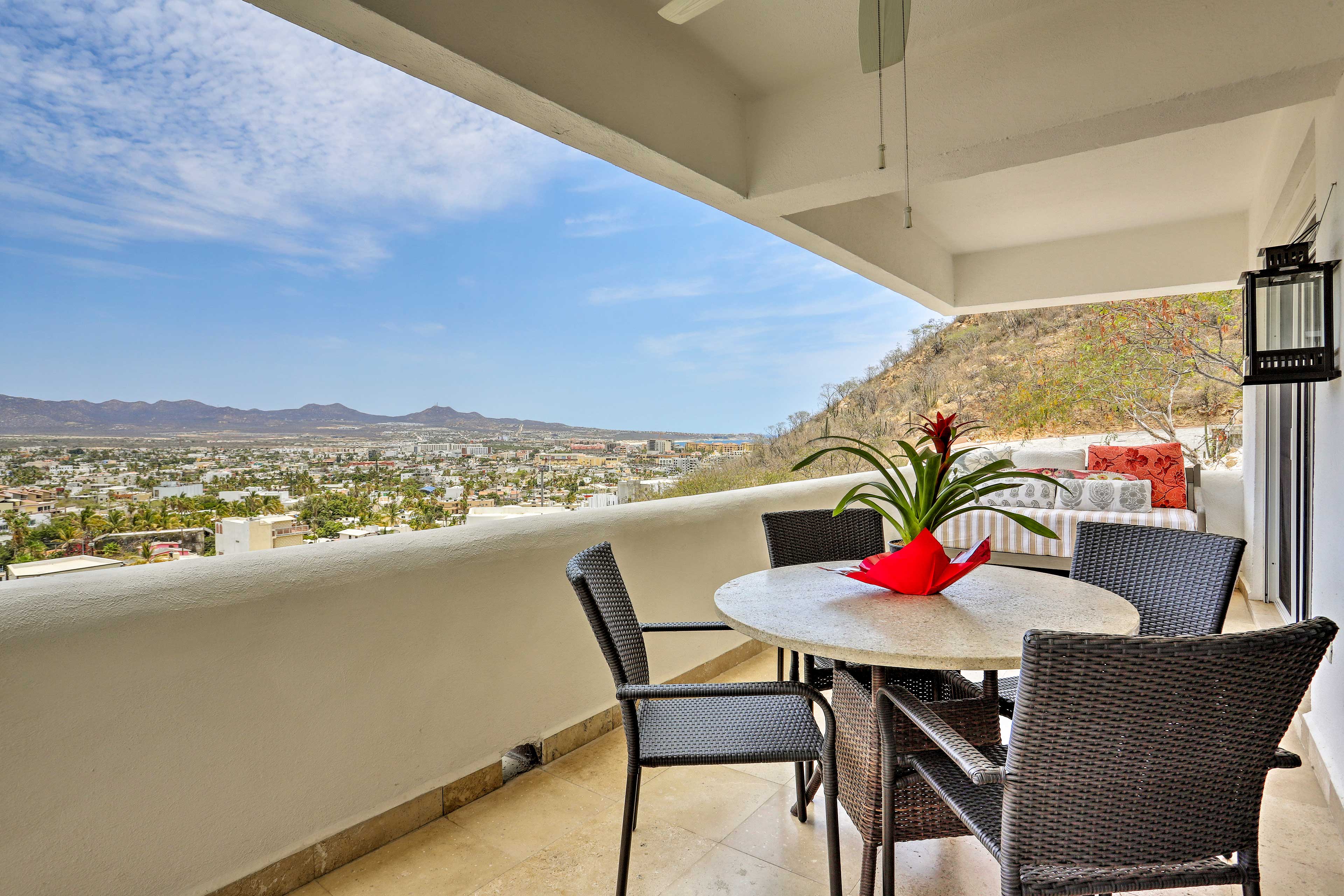 Take in the views of the mountains and city from the balcony.