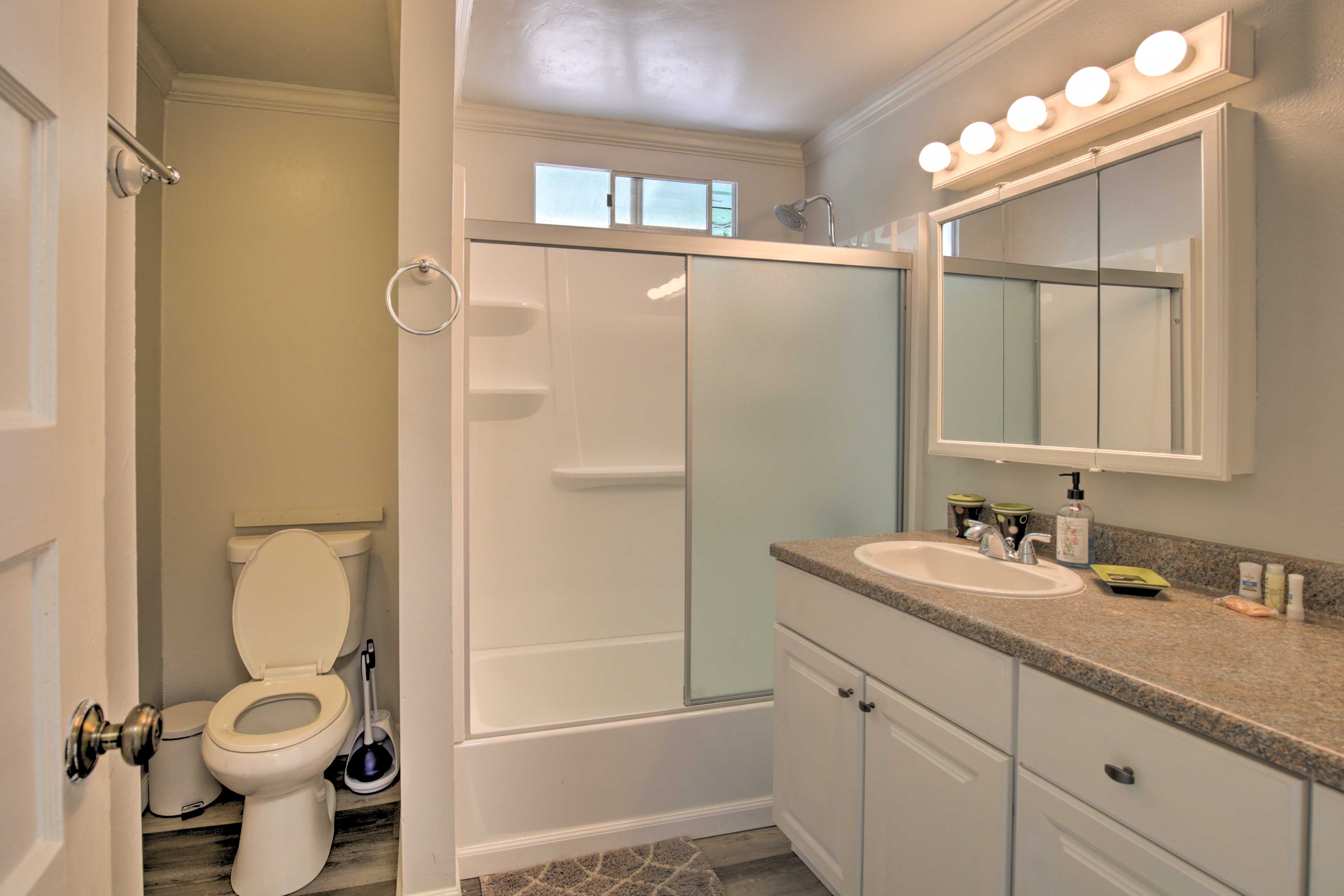 Maintain your morning routine with ease in this full bathroom.